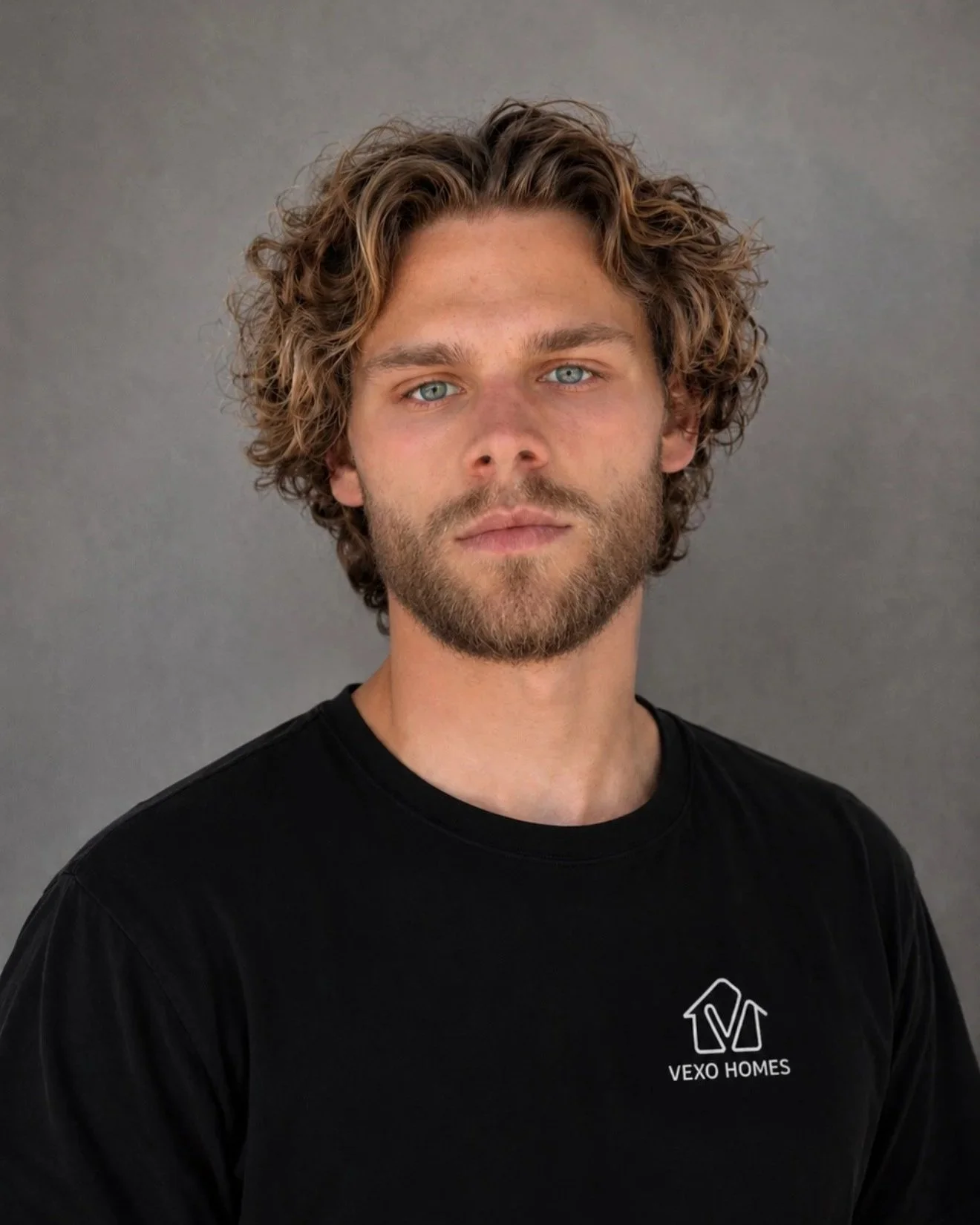 Stepan Salomatin, owner of Vexo Homes, wearing a black Vexo Homes shirt.