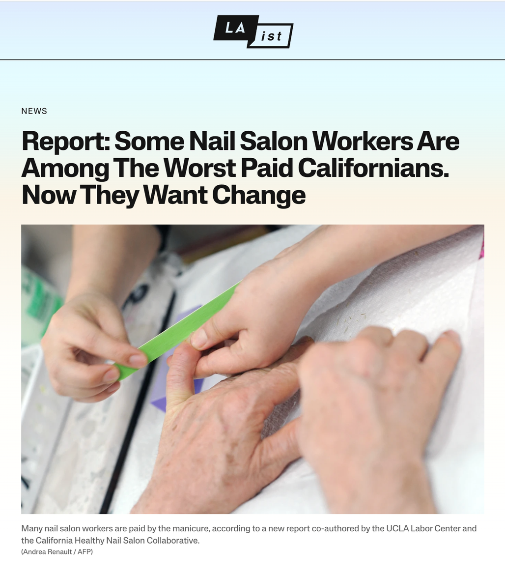 Close-up of a nail technician filing a client's nails at a nail salon.