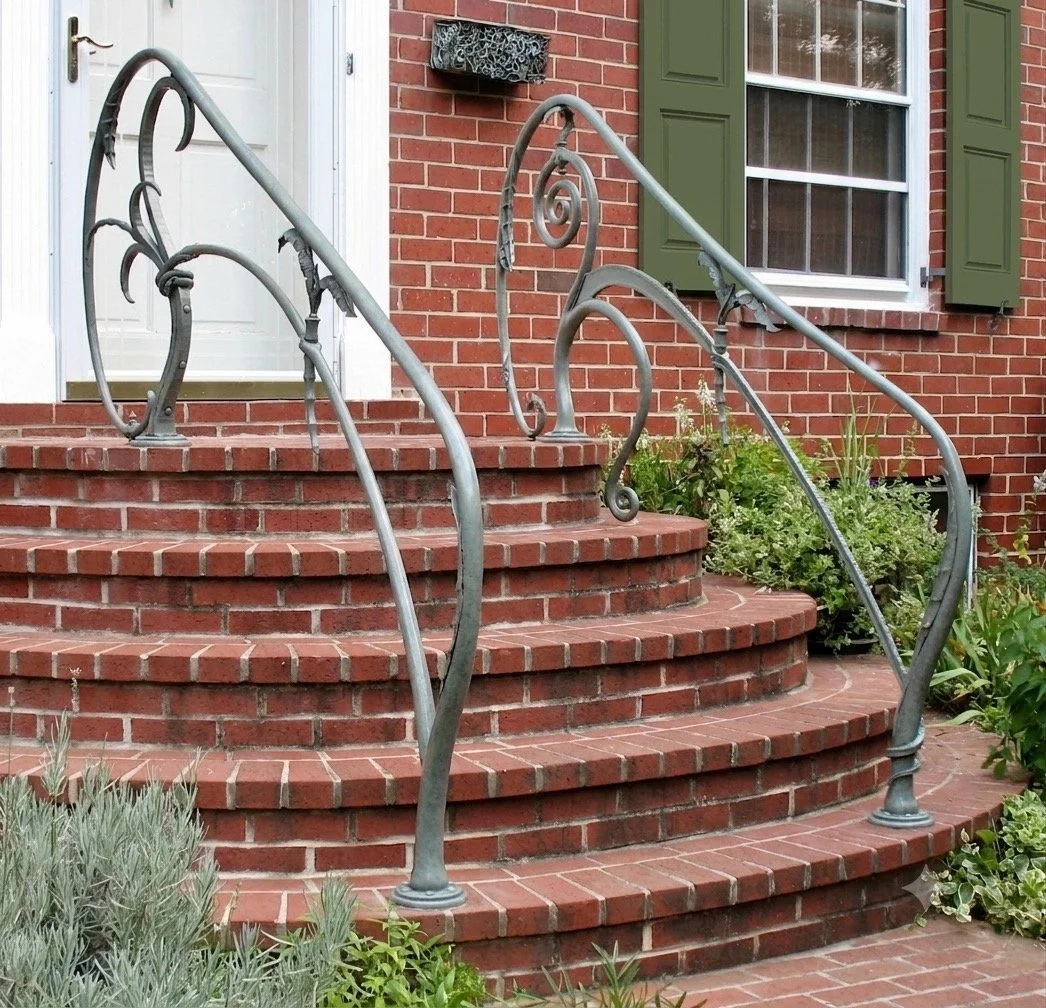 Hand forged biomorphic sculptural exterior handrails