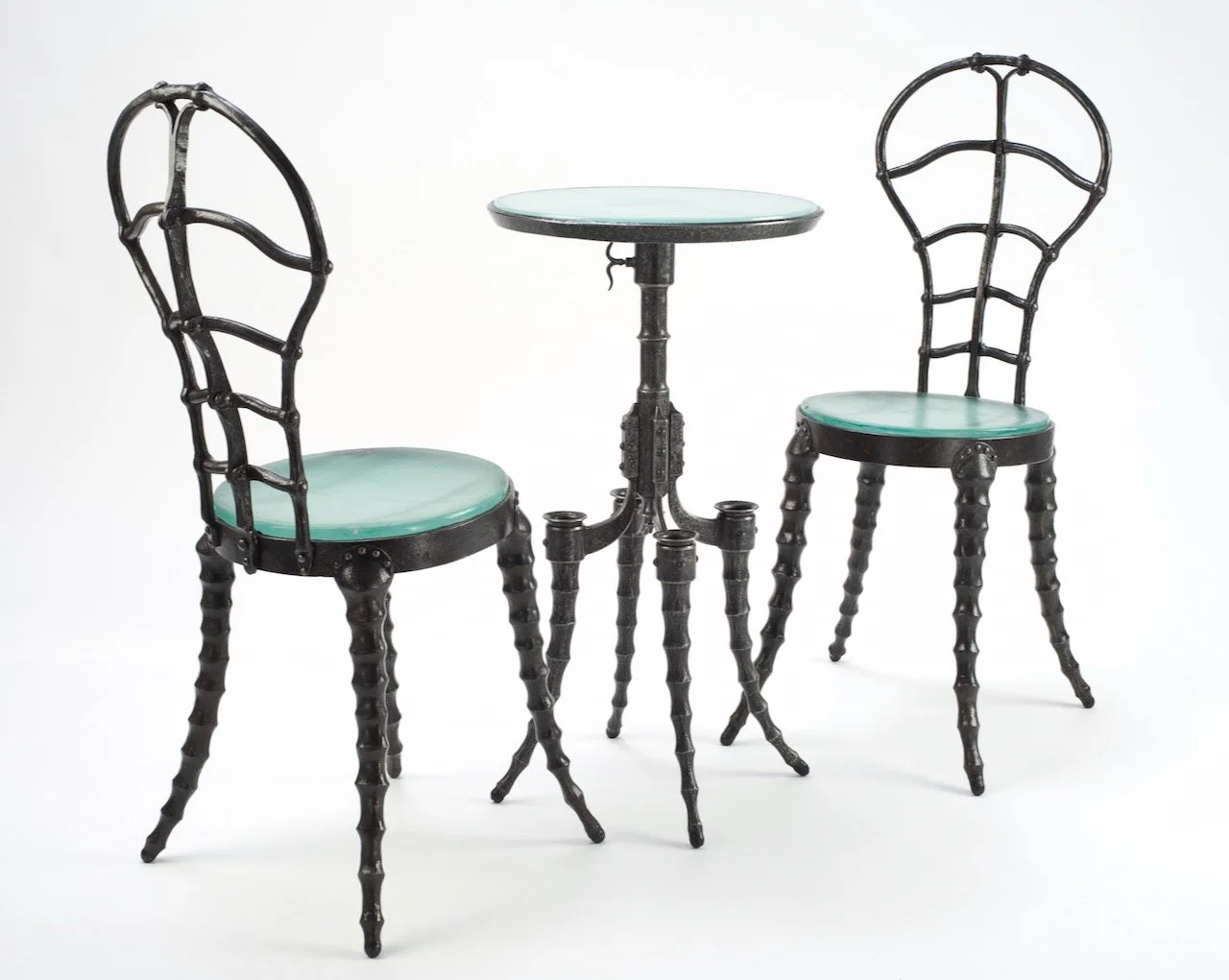 Forged iron steampunk cafe chair and pedestal table with cast glass seats
