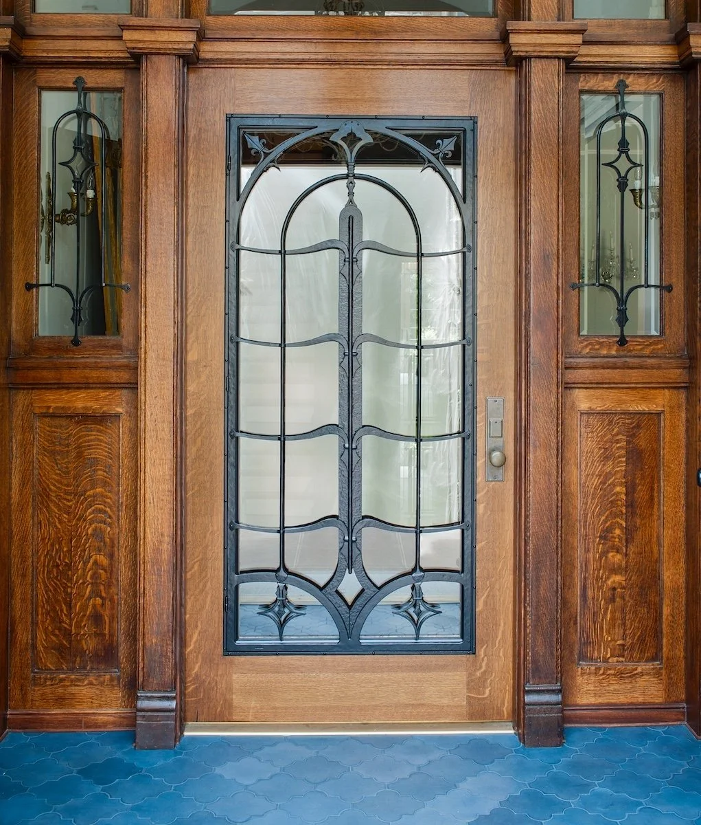 Forged Iron custom front door grille with hand forged joinery