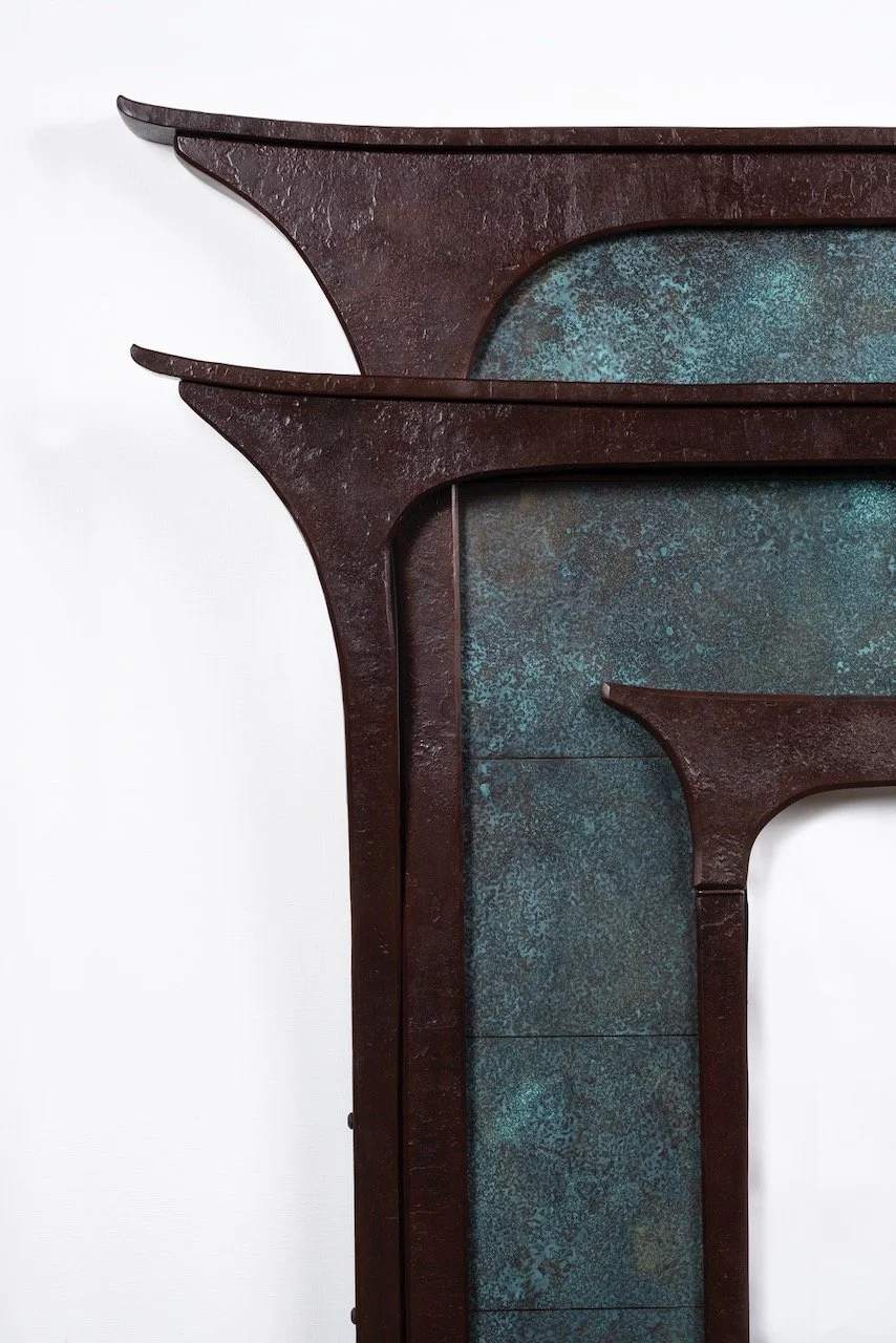 Custom mantelpiece in forged iron and patinated bronze