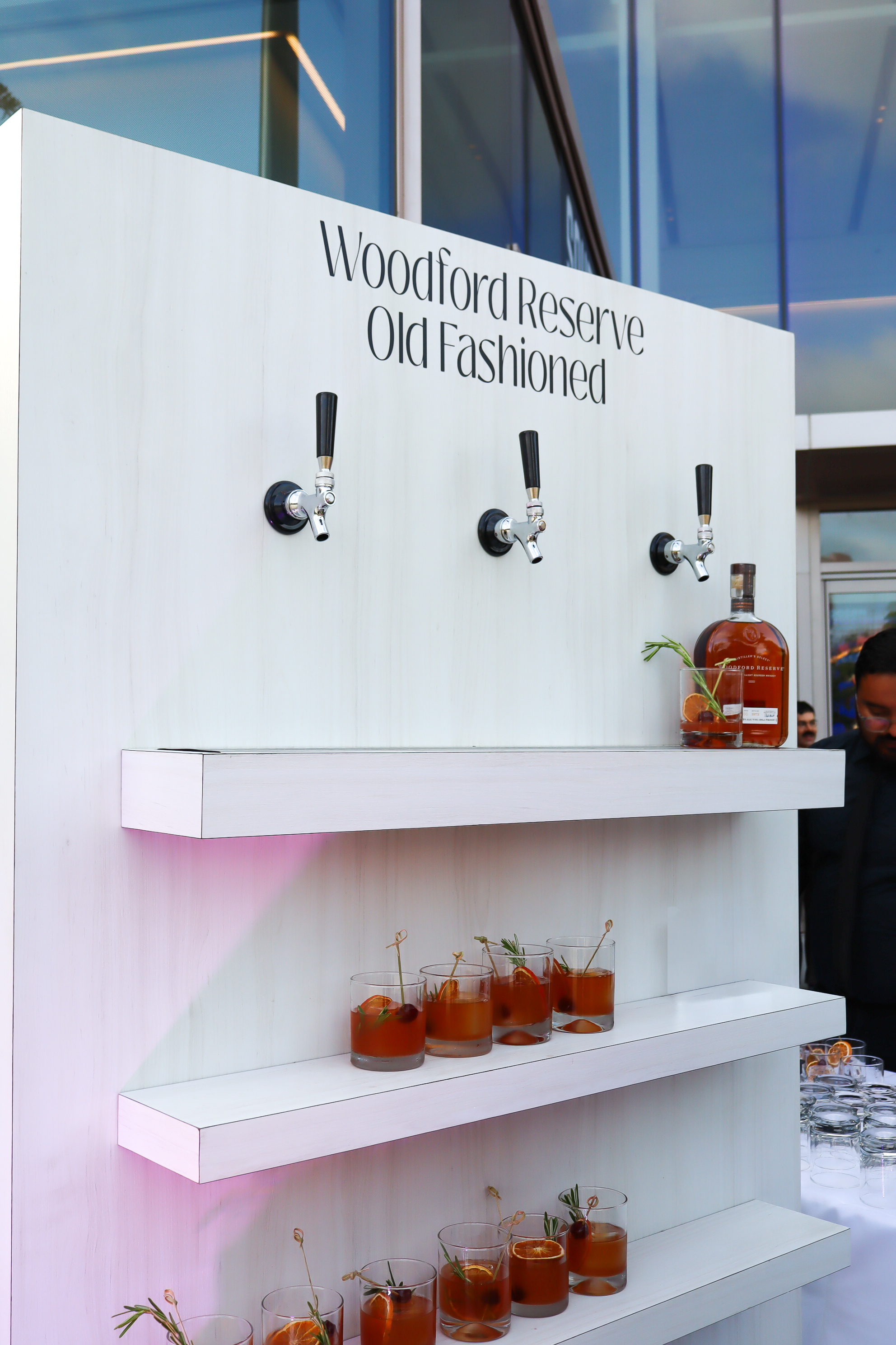 Woodford Reserve Old Fashioned Drink wall with a 8 filled glasses of old fashioned 