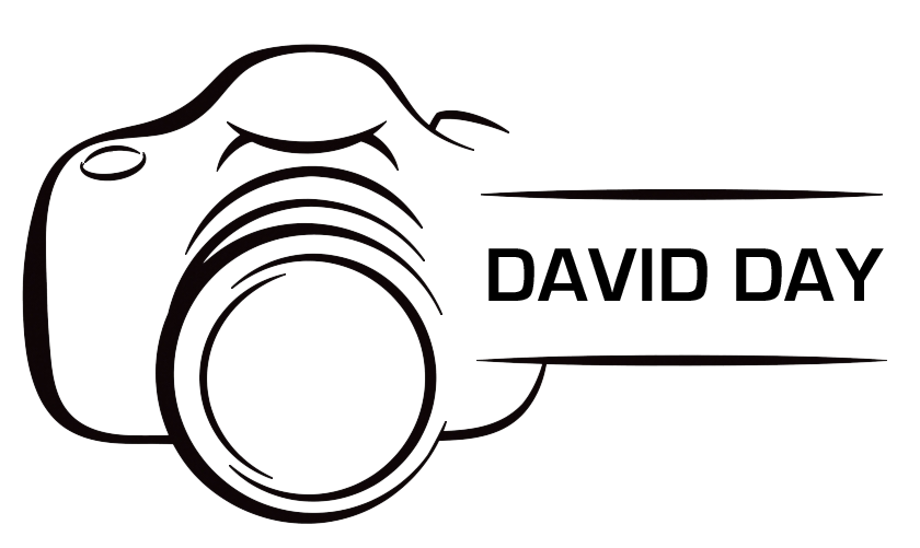 Line drawing of a camera with motion lines indicating speed.