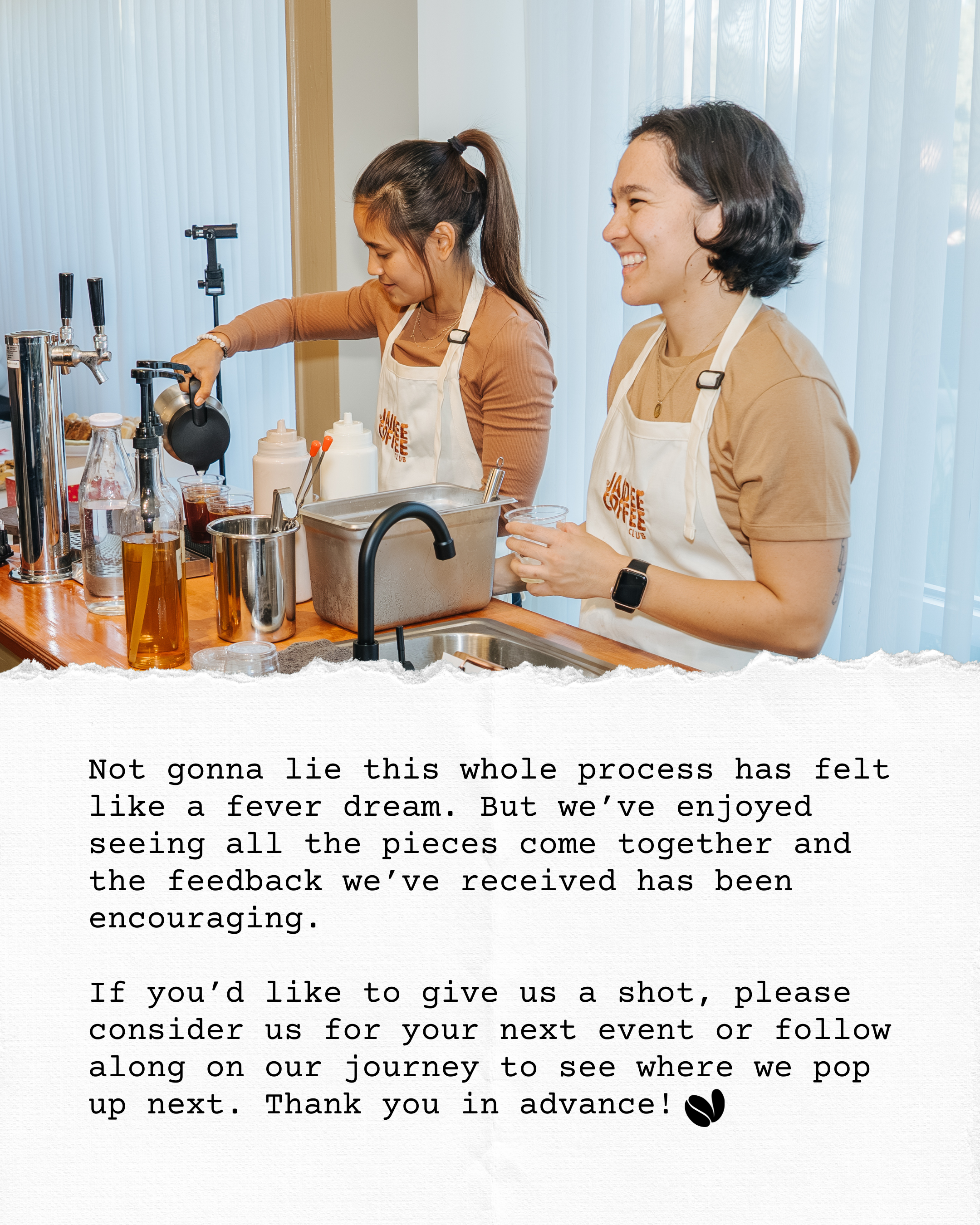 Two women wearing aprons at a bar or café counter, preparing drinks. One woman is pouring a dark liquid from a small container into clear cups, while the other is smiling and holding a small clear cup. The counter has bottles, dispensers, and kitchen tools, with a background of vertical blinds covering windows.