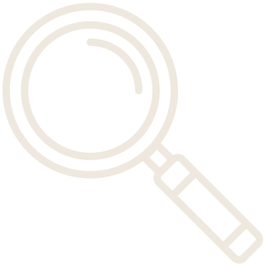 Magnifying glass icon with a circular lens and handle.