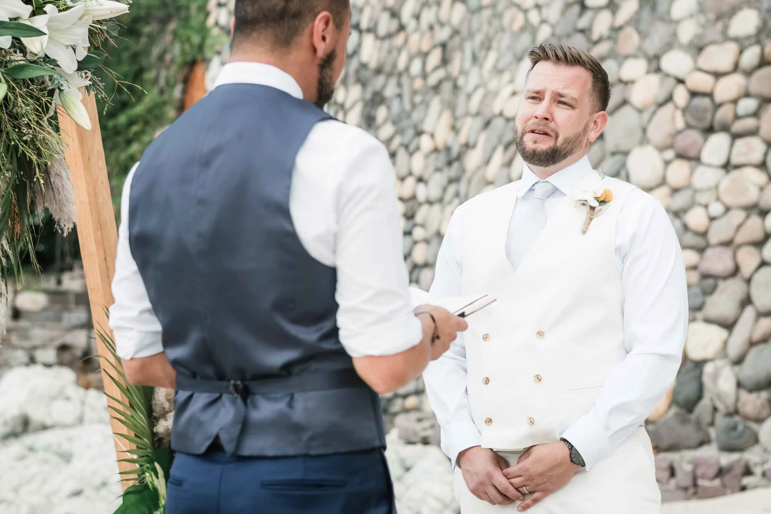 Emotional groom during their vow exchange at the Conchas Chinas beach in the gay friendly city of Puerto Vallarta Mexico