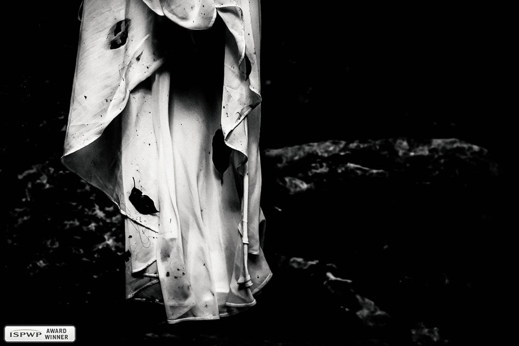 Close-up of a wedding dress after a trash the dress photo session. 