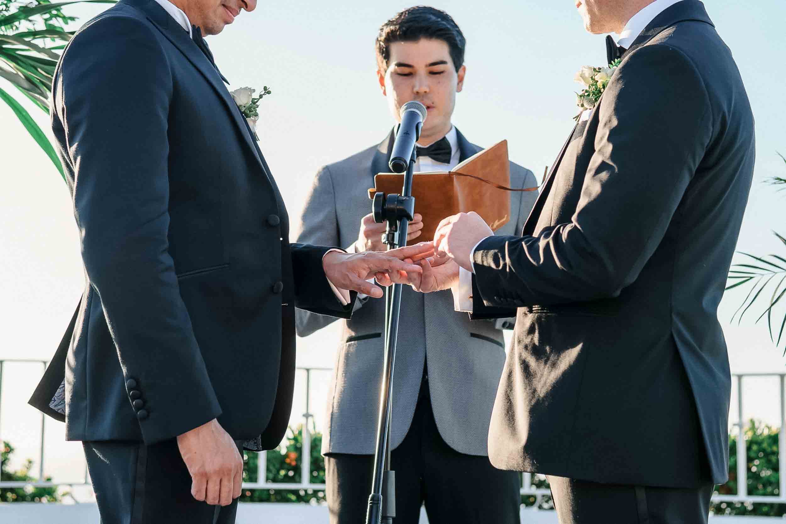 Ring exchange during gay wedding at the Grand Miramar Luxury Resort Vallarta