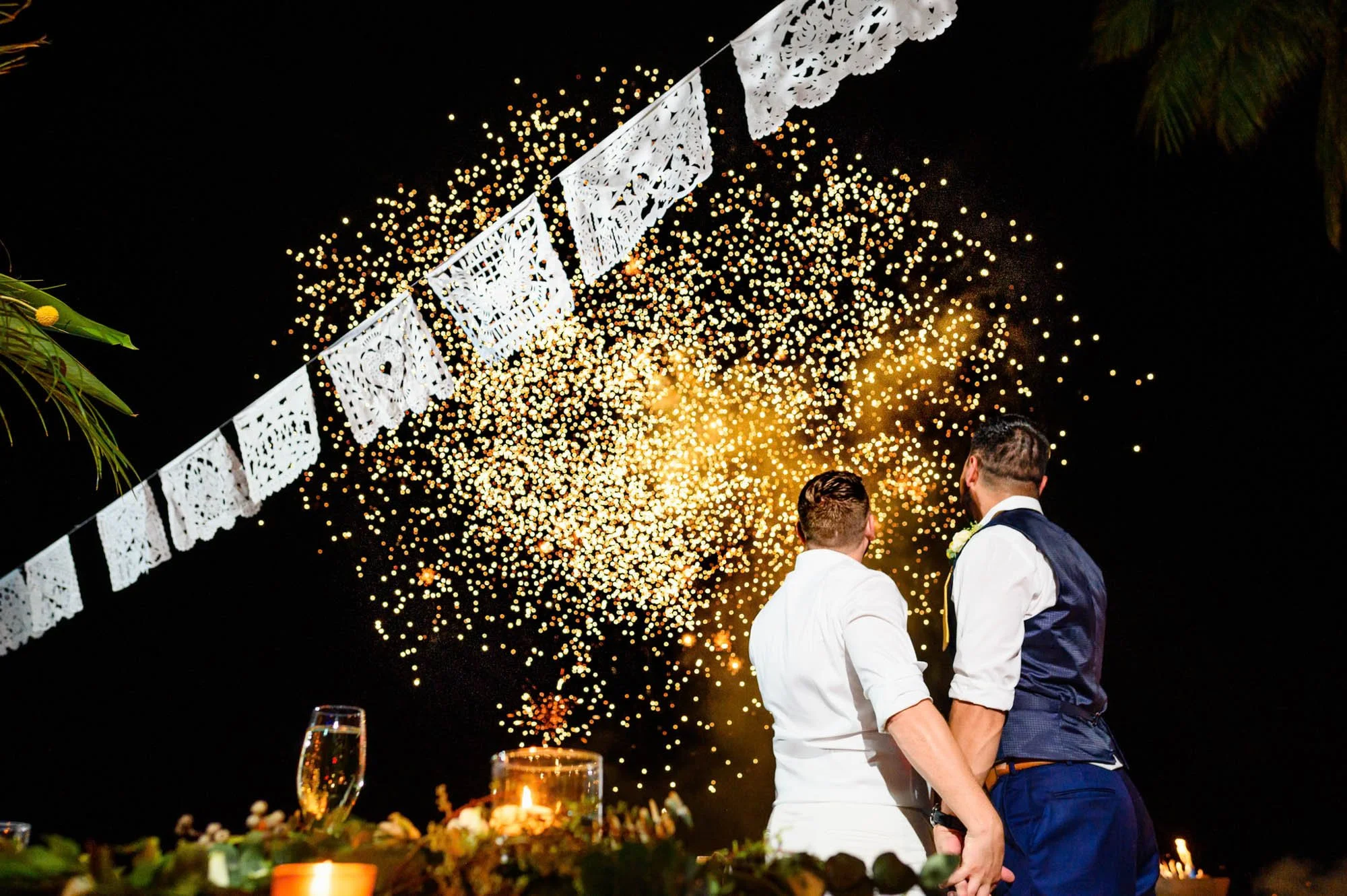 Beautiful fireworks at the end of the first dance of a LGBTQ gay couple at their wedding.