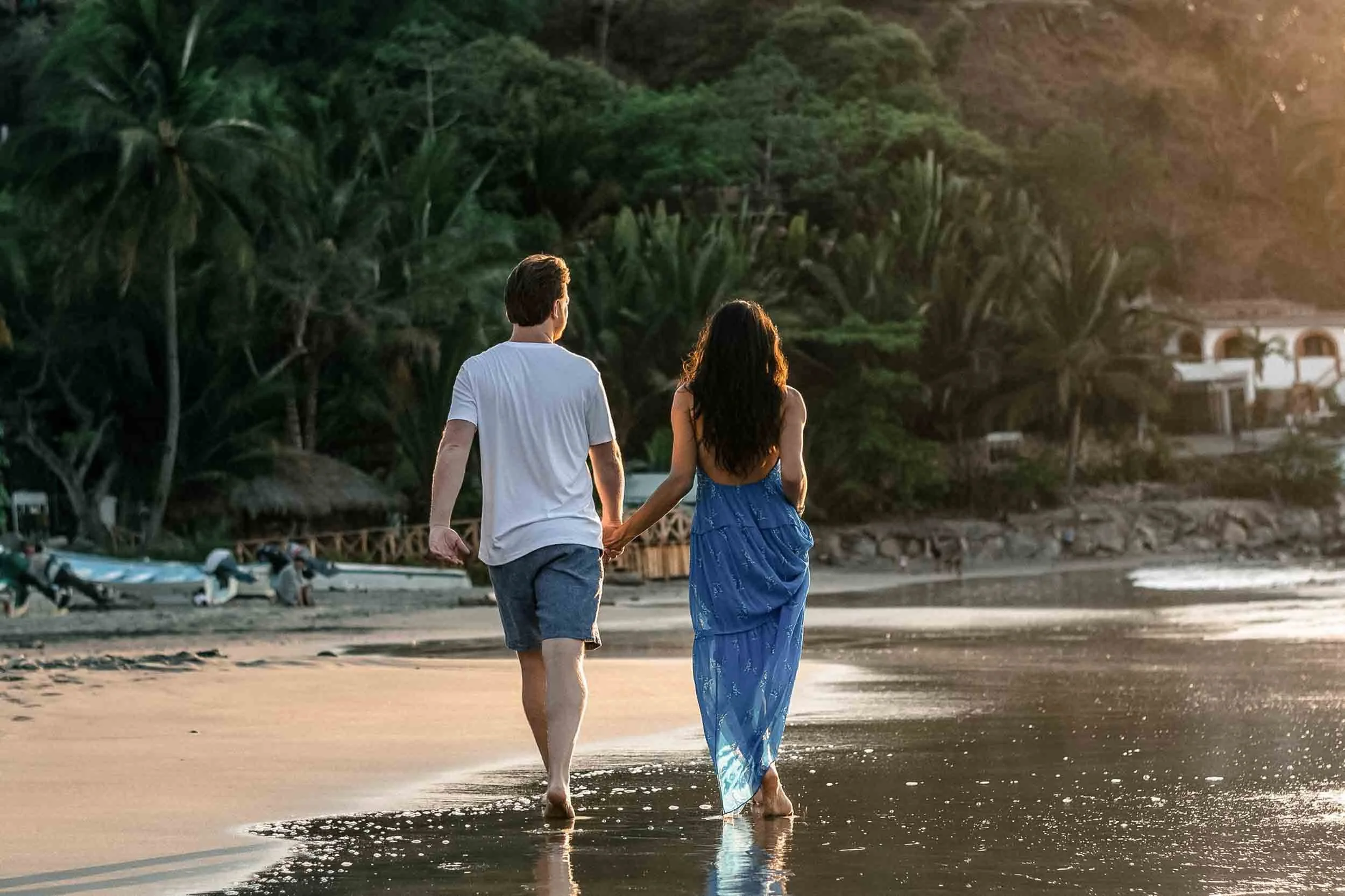 Couple walking along the beach during engagement session in Puerto Vallarta