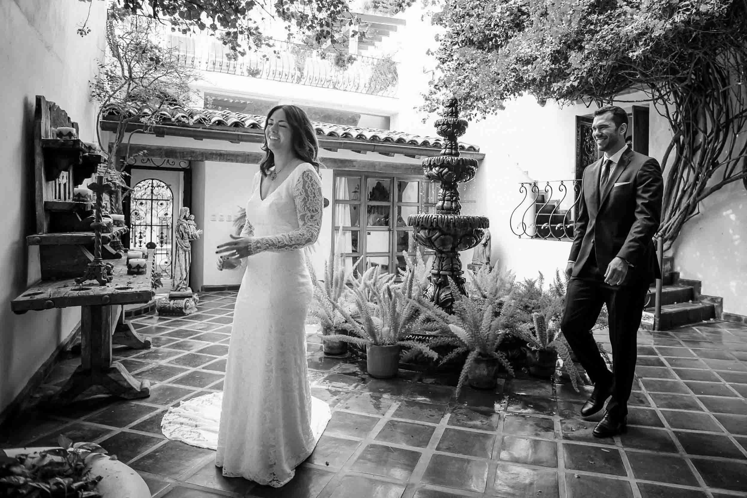 Bride waiting for groom to encounter her during their first view before their wedding ceremony.