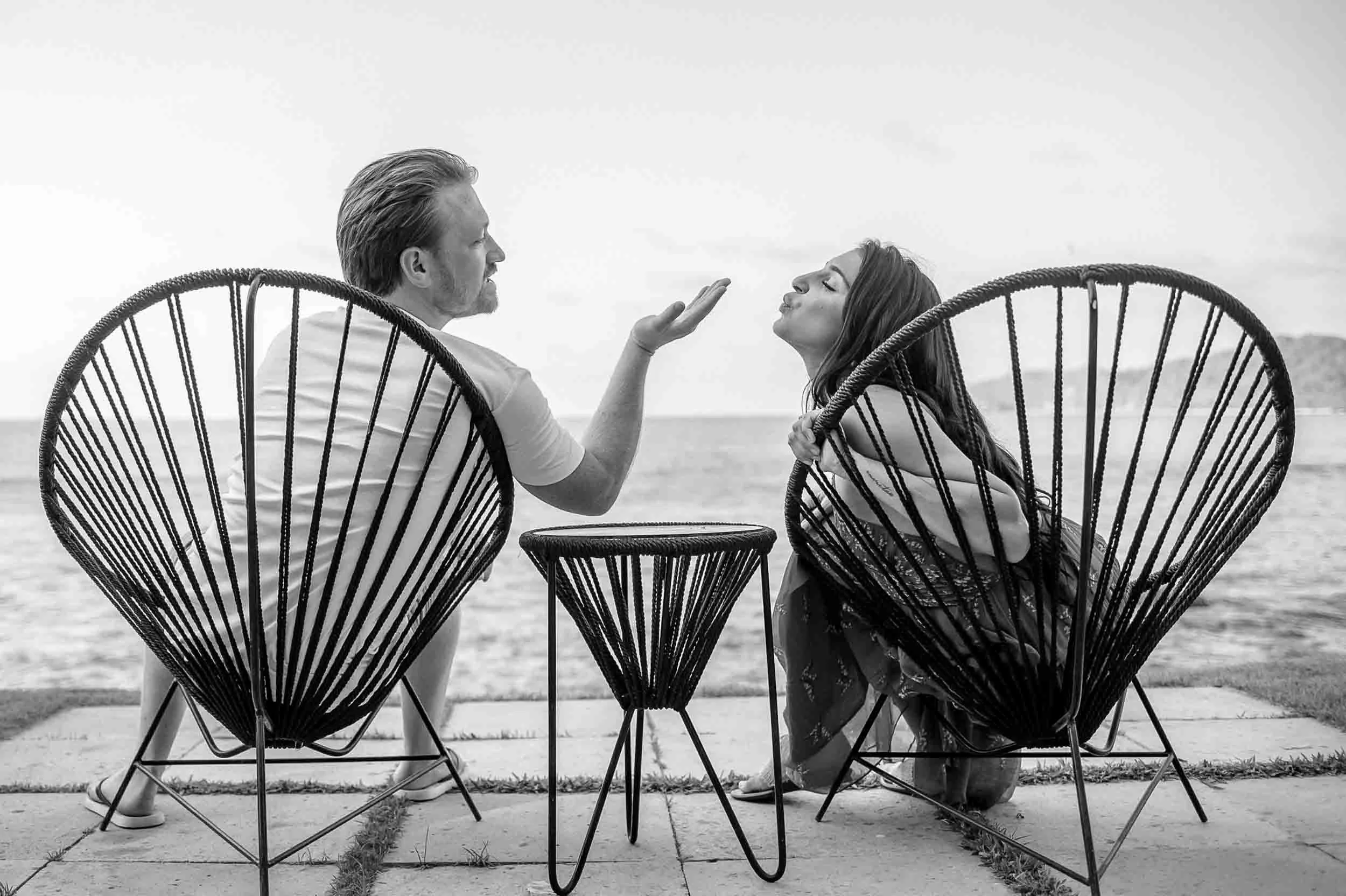Fun time blowing a kiss during an engagement session.