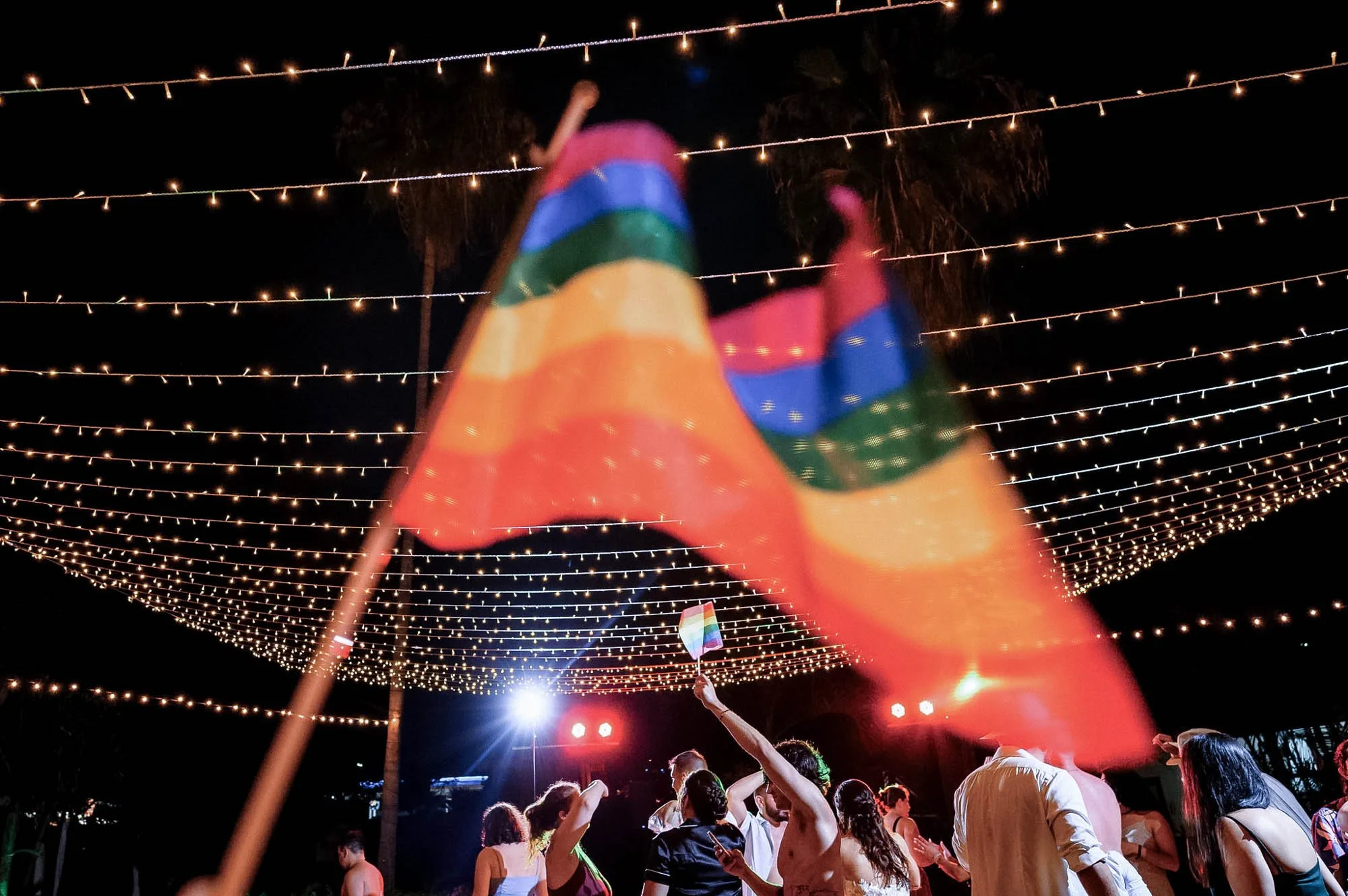 LGBTQ flag detail during wedding party at a destination beach wedding in Puerto Vallarta.