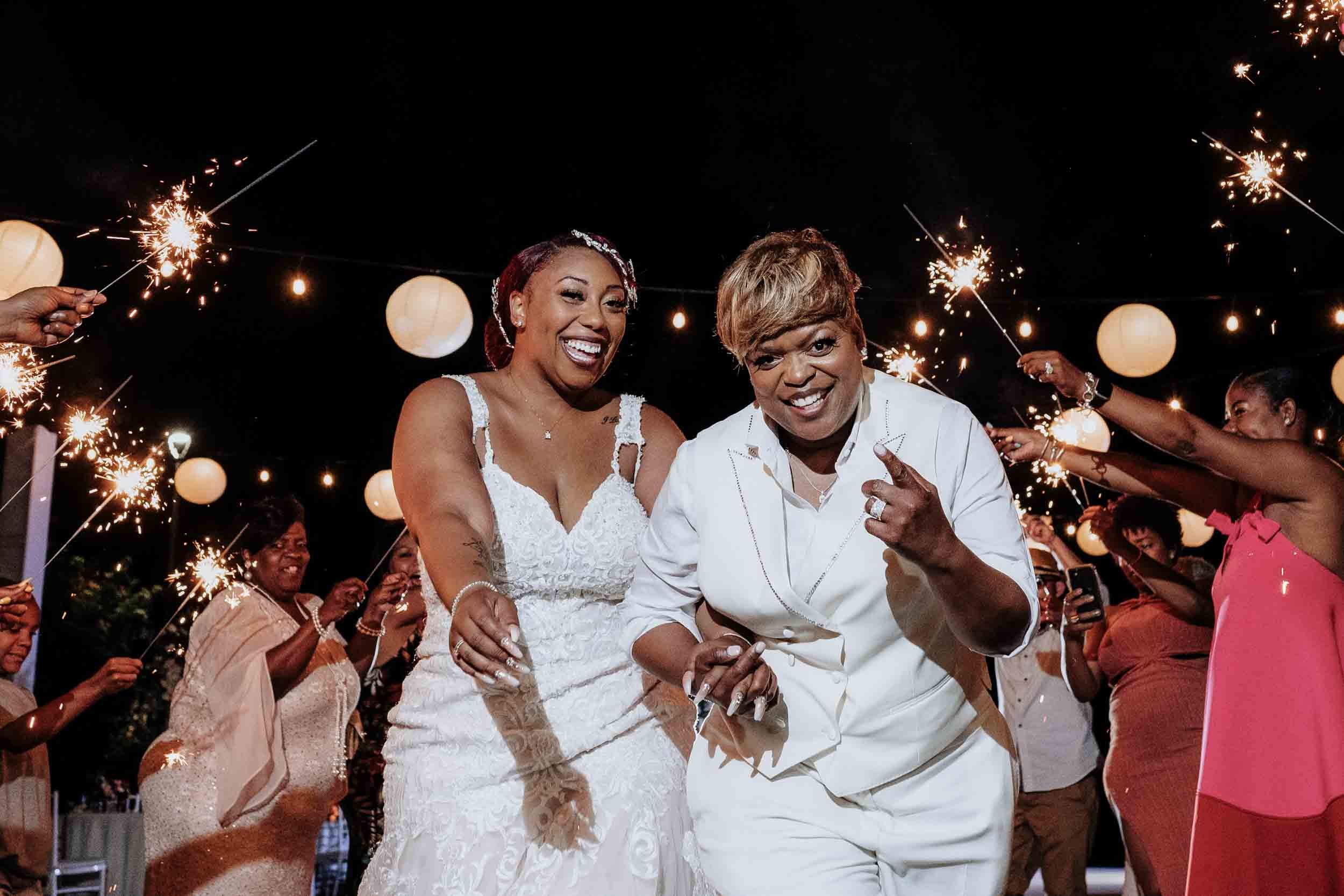 Sparkler exit of lesbian couple at the end of their wedding day at the Marriott resort in Puerto Vallarta Mexico 