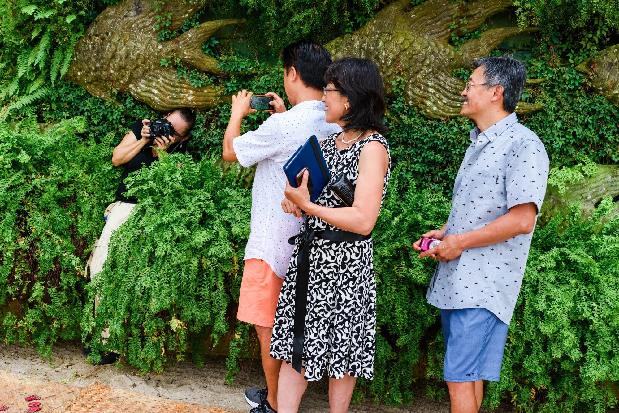 Person taking photo of wedding photographer working