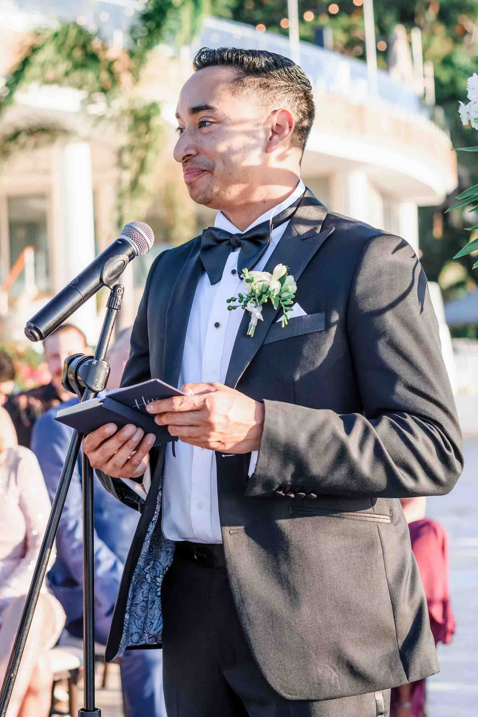 Groom saying his vows during a LGBTQ wedding ceremony.
