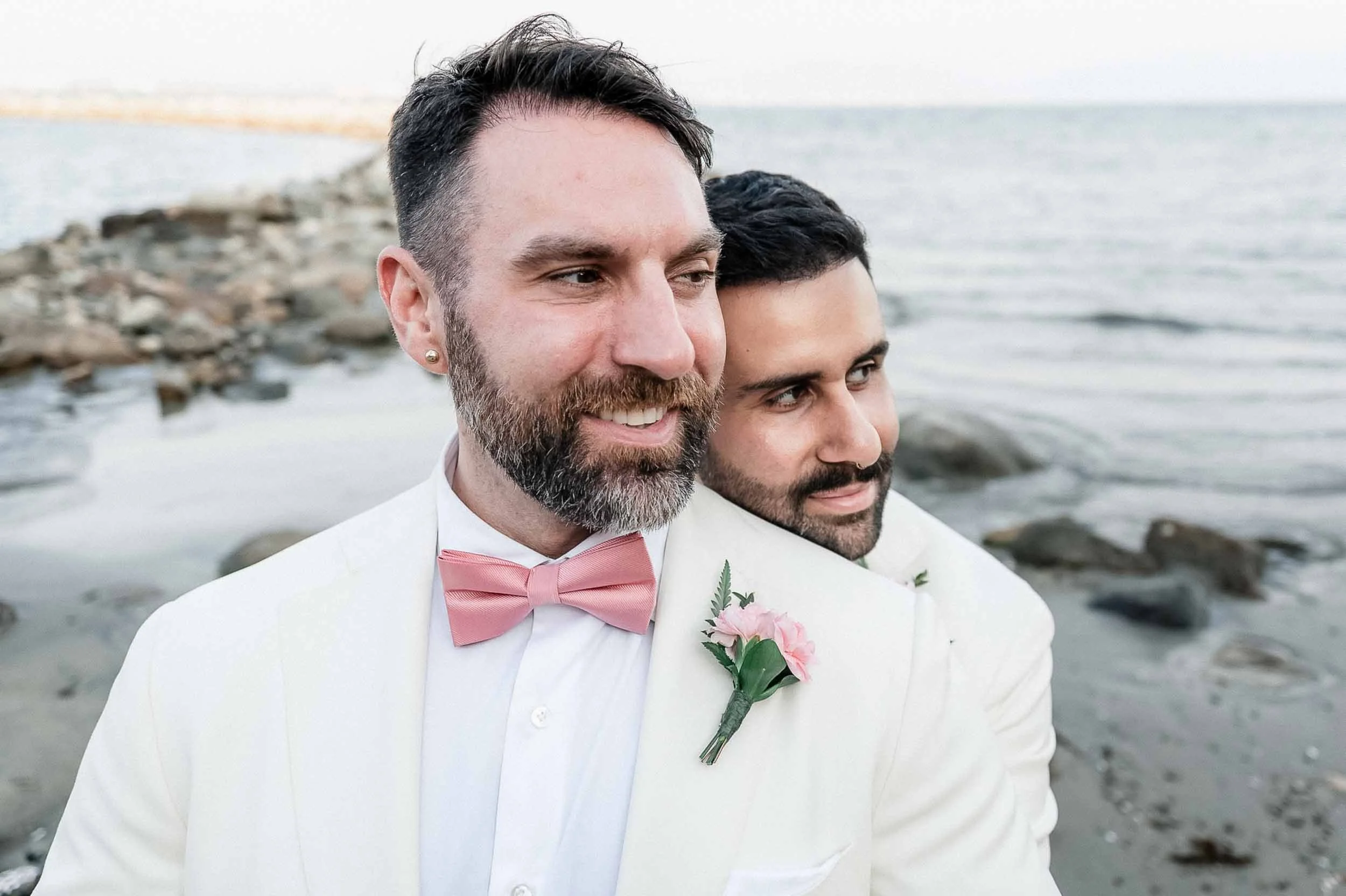 Grooms posing for portraits after their wedding ceremony in Puerto Vallarta Mexico