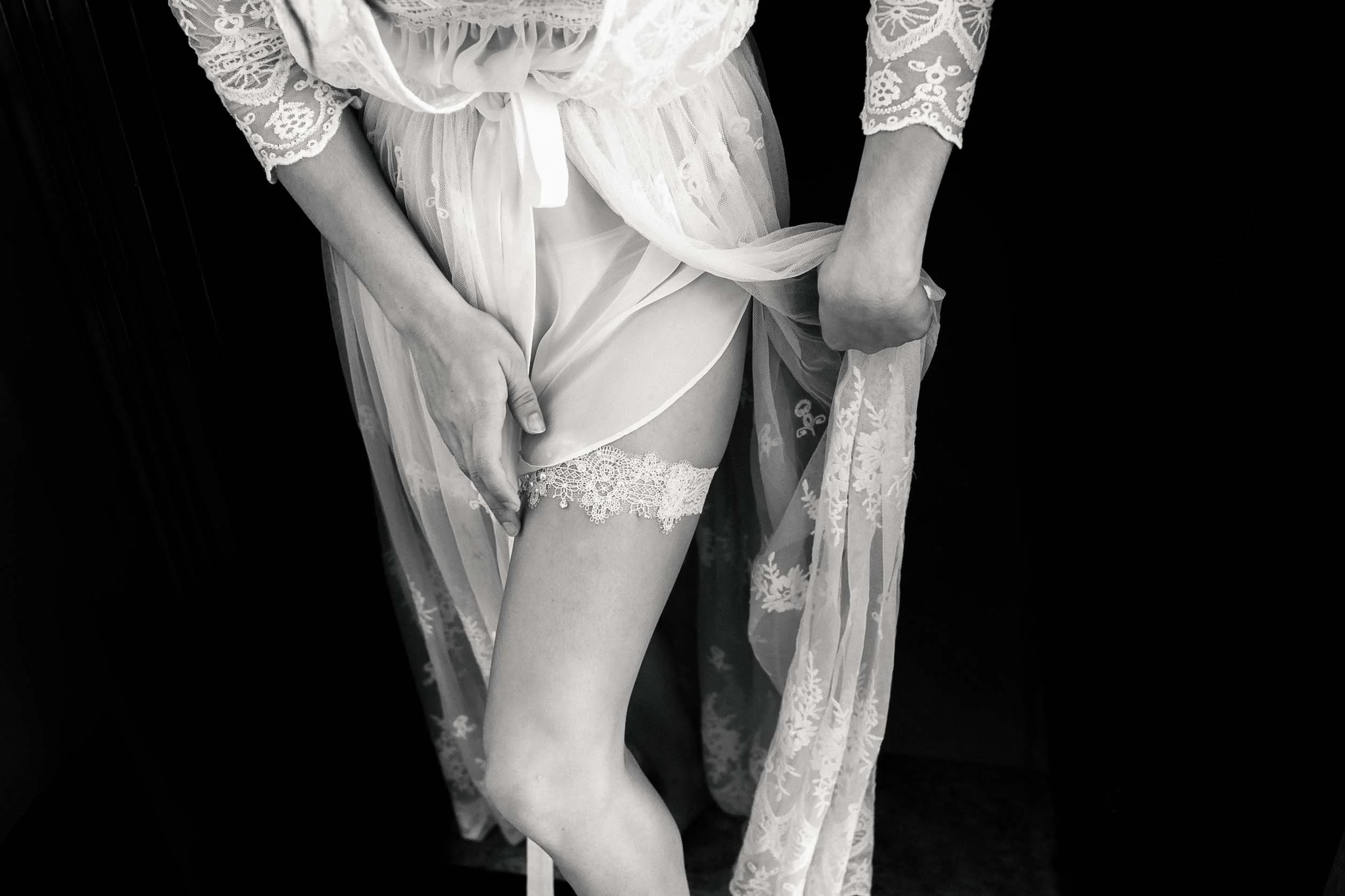 Bride in lace and garter getting ready for her Puerto Vallarta wedding ceremony