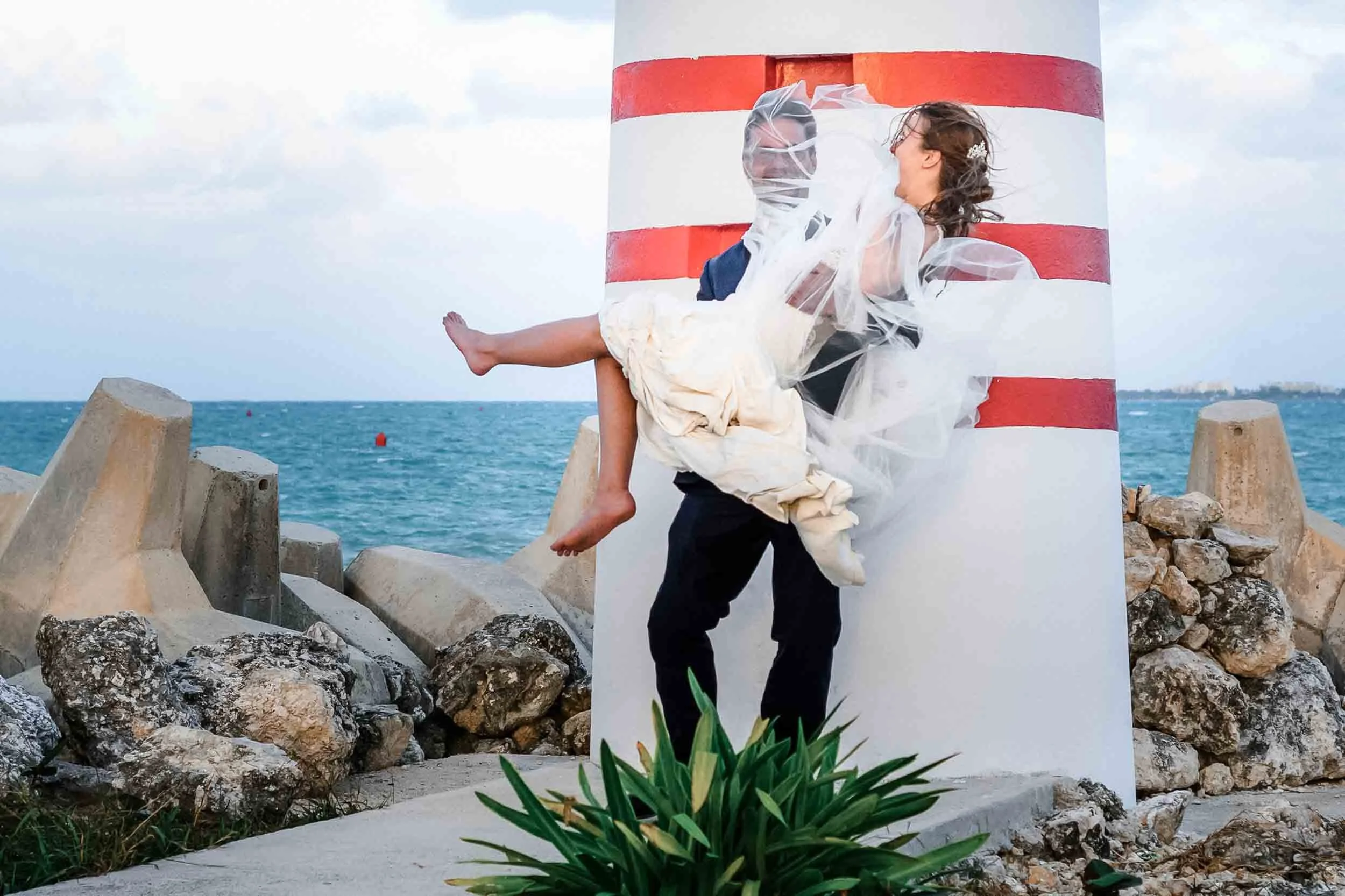 Fun portrait of bride and groom during their beach wedding weekend in Puerto Vallarta
