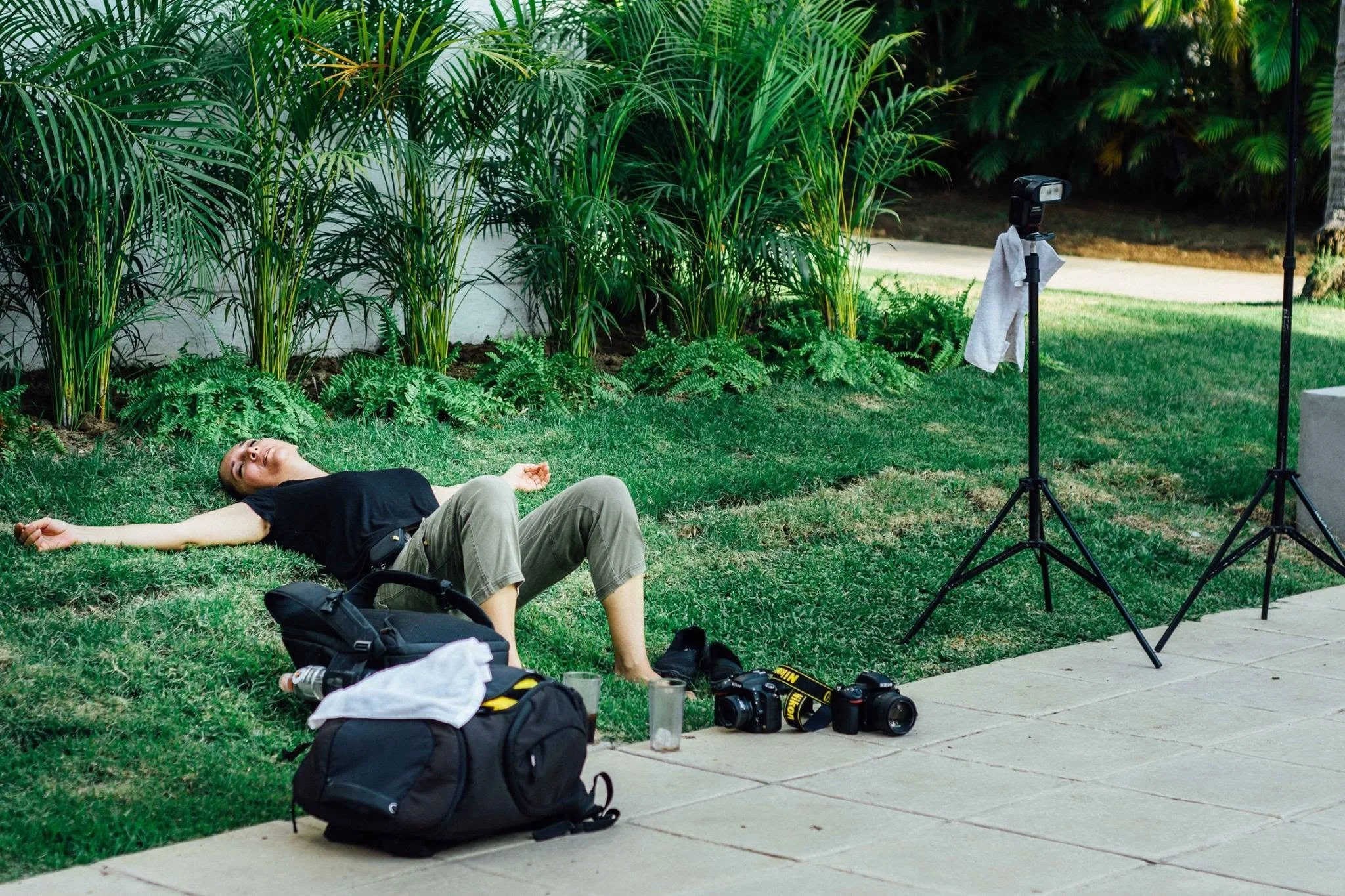 Wedding photographer exhausted from a hot and humid day