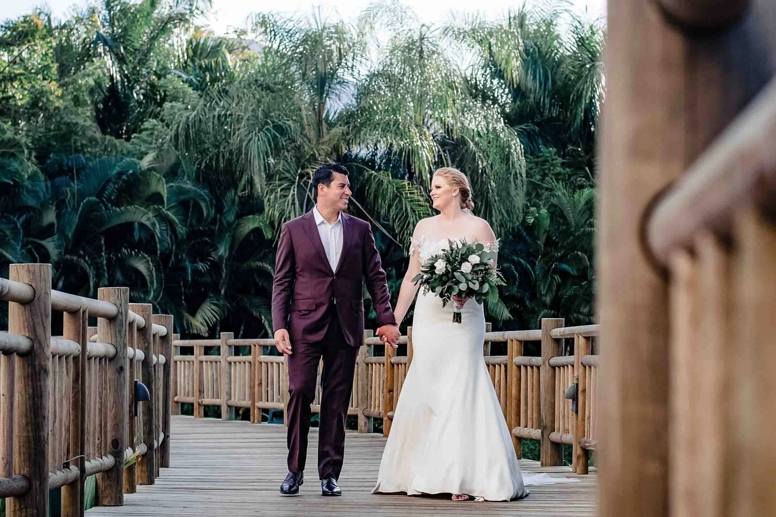 Bride and groom walking during their portrait session after their wedding ceremony in Puerto Vallarta