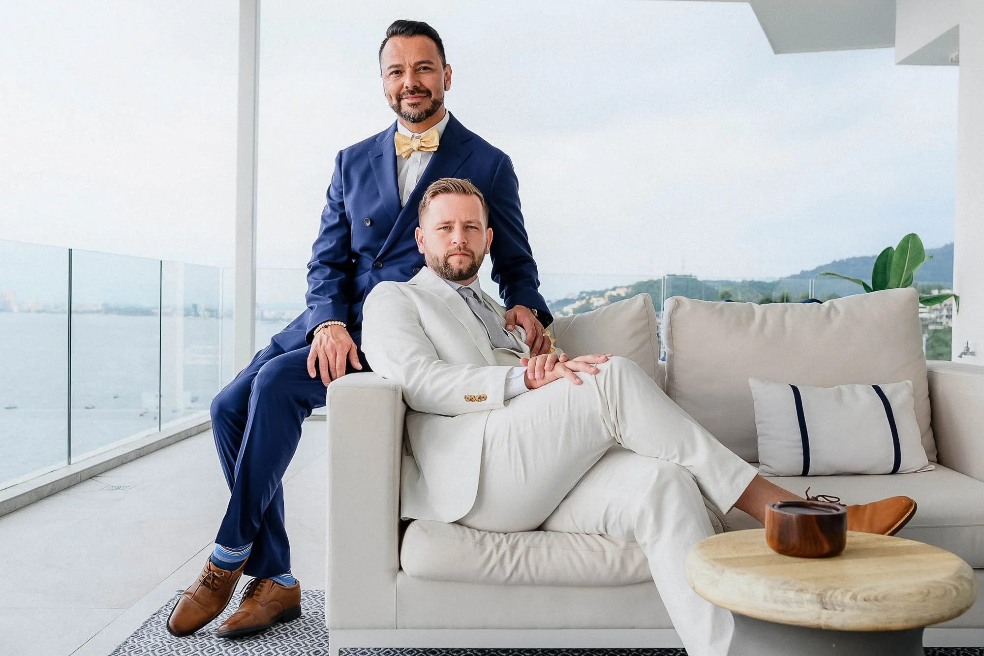 Gay couple sitting in a balcony for photo shoot