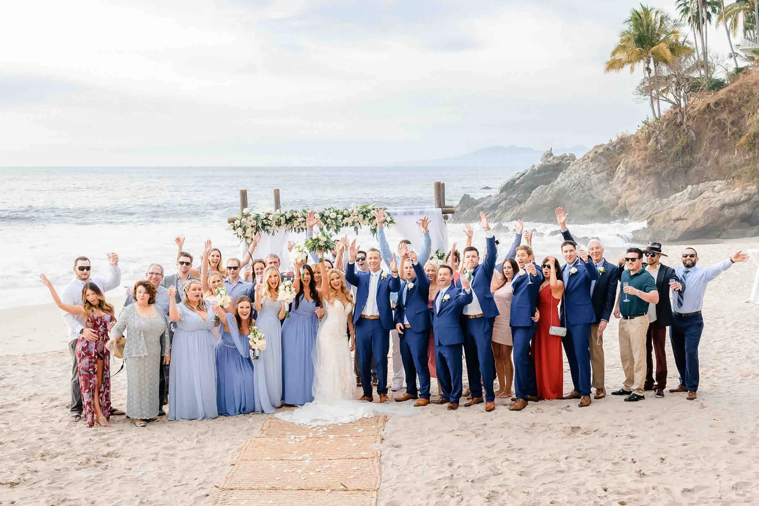 Group photo after beach destination wedding ceremony in Puerto Vallarta. 