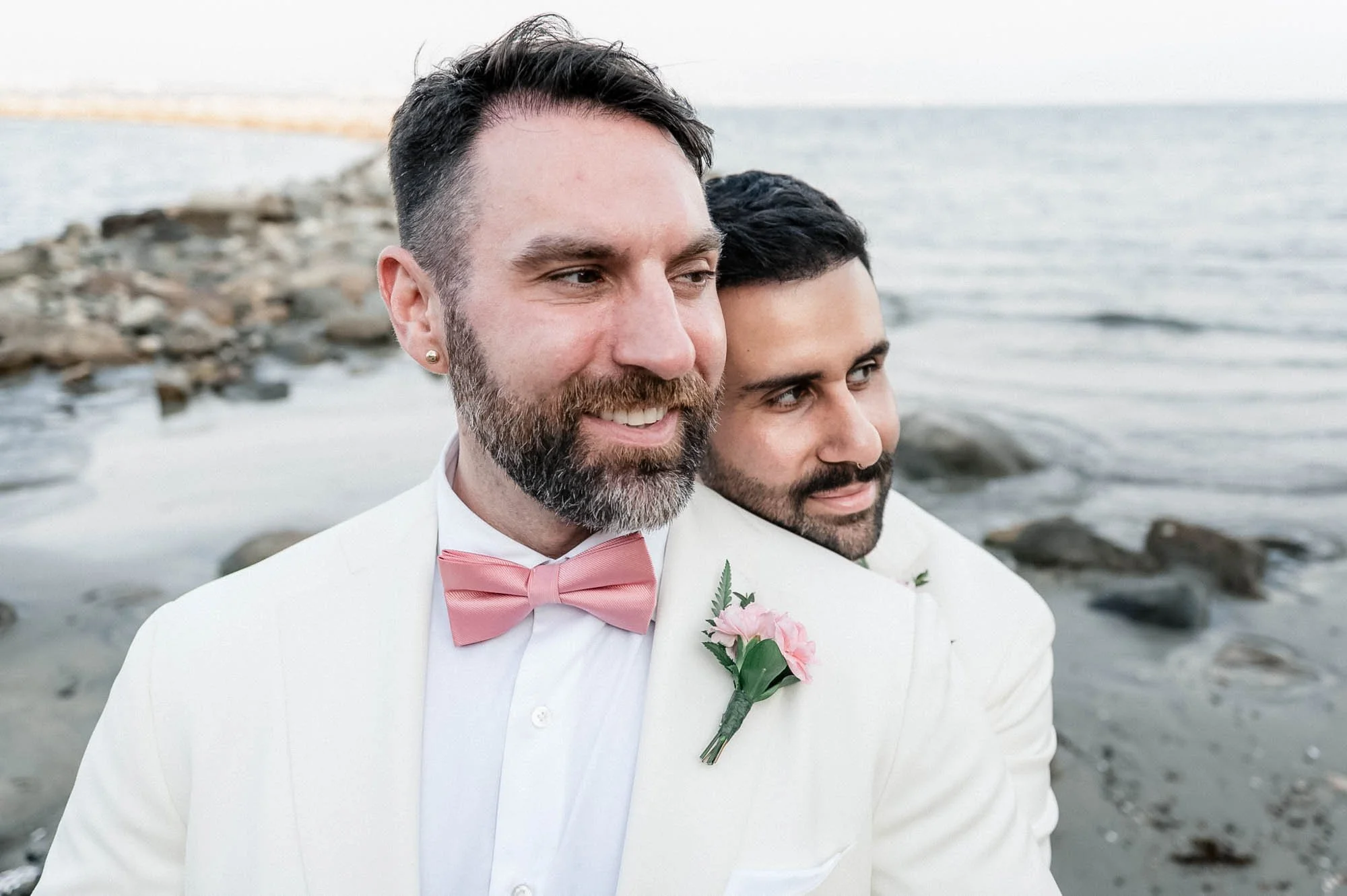Grooms posing for portraits after their destination wedding ceremony.