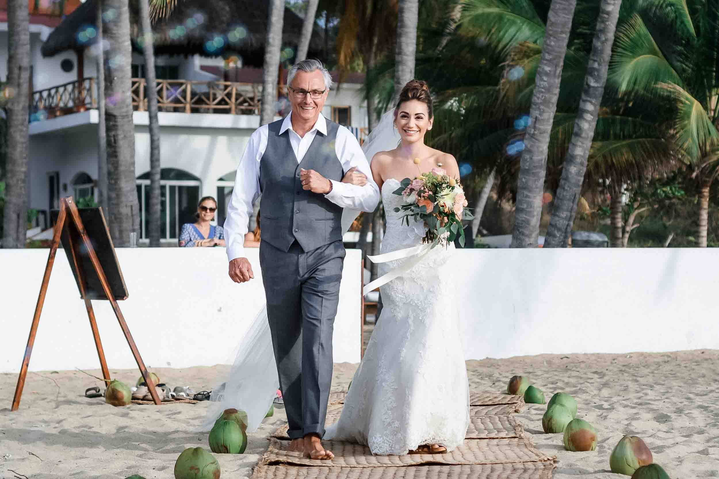 Father walking bride down the aisle in Puerto Vallarta beach wedding