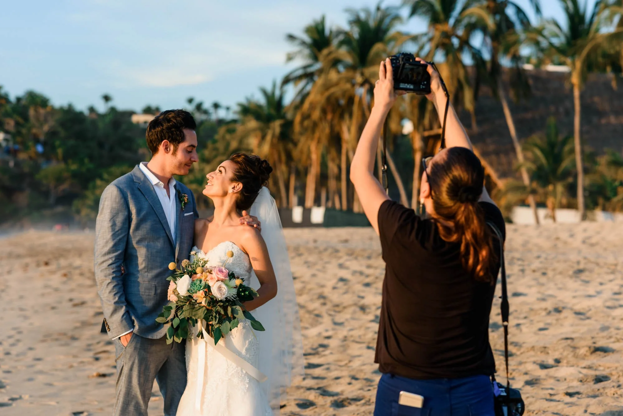 Bride and groom during portrait session with photographer