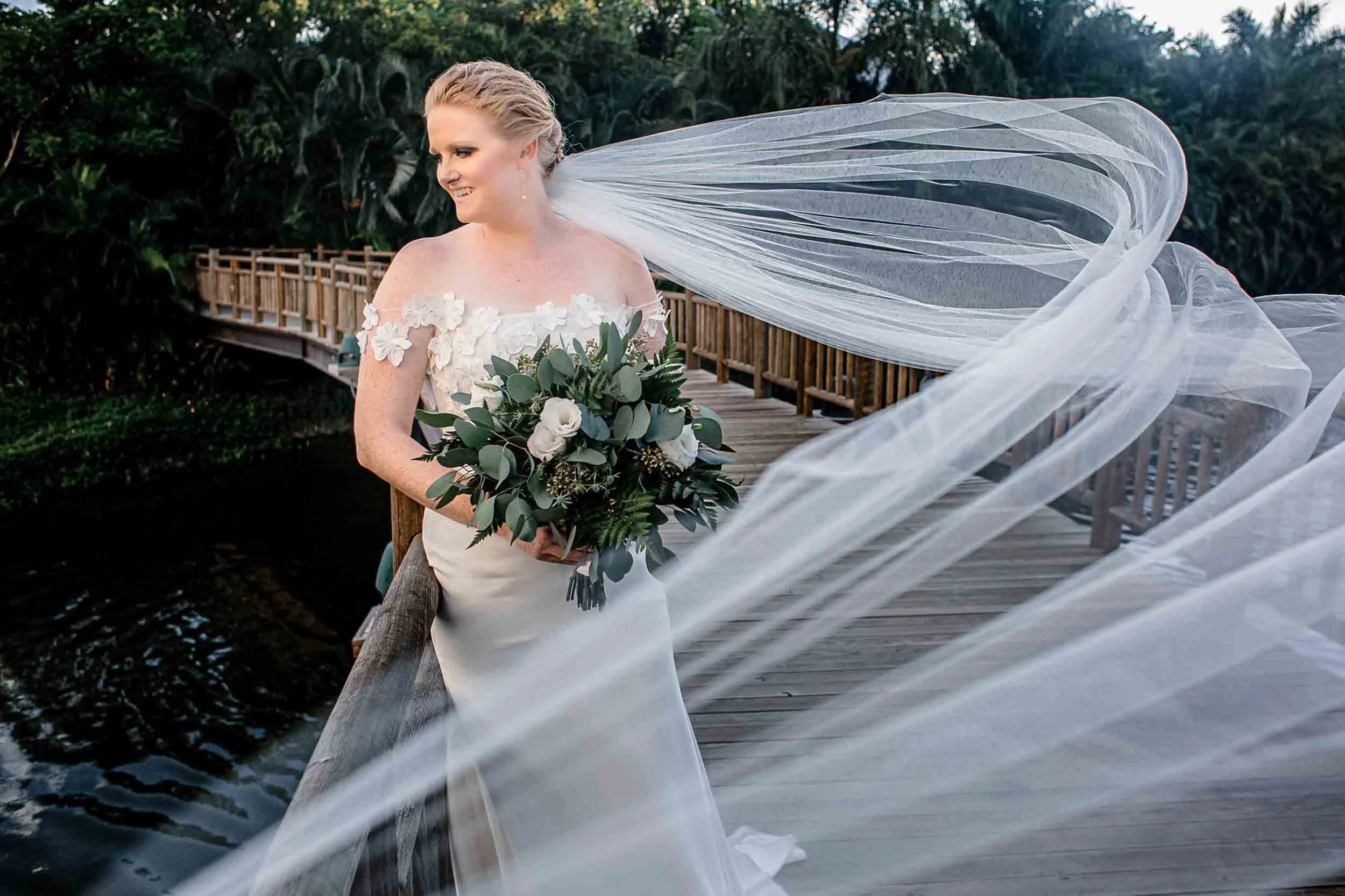 Bride posing with flying veil in Vallarta destination wedding