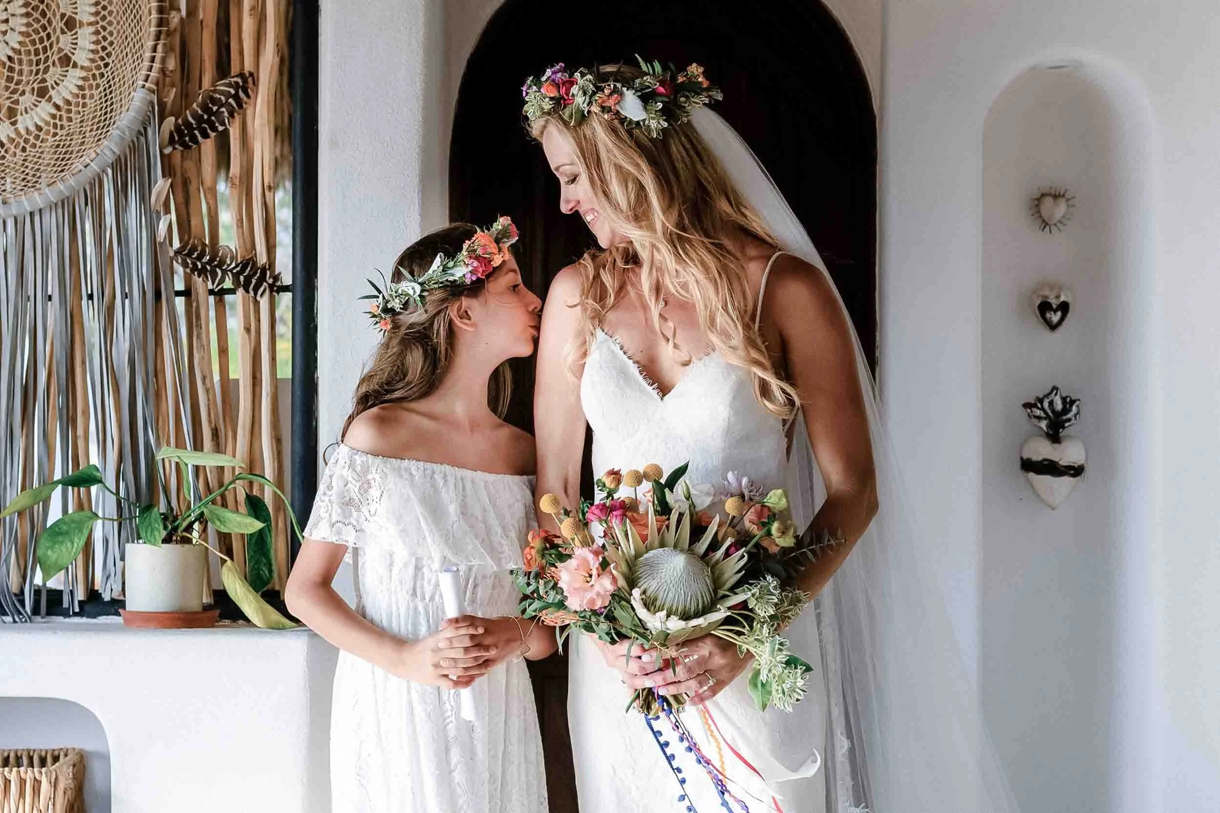 Daughter kissing bride before wedding ceremony in Puerto Vallarta