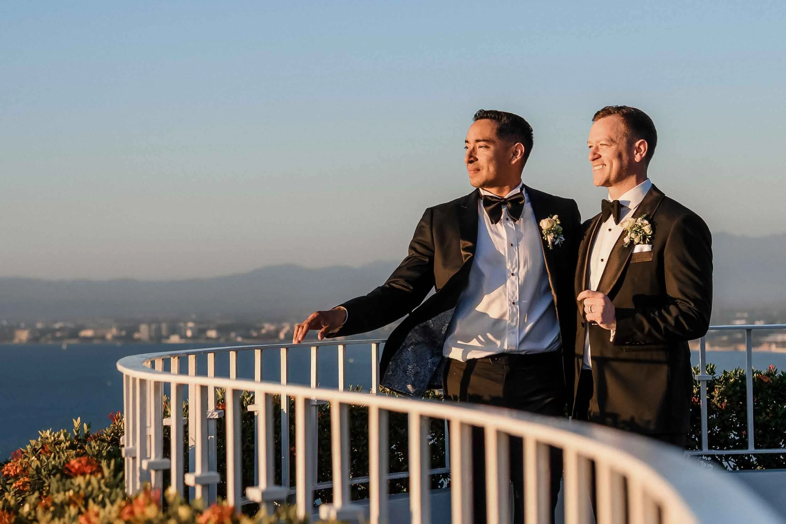 Sunset portrait of grooms after their wedding ceremony held at the luxury resort Grand Miramar in Puerto Vallarta