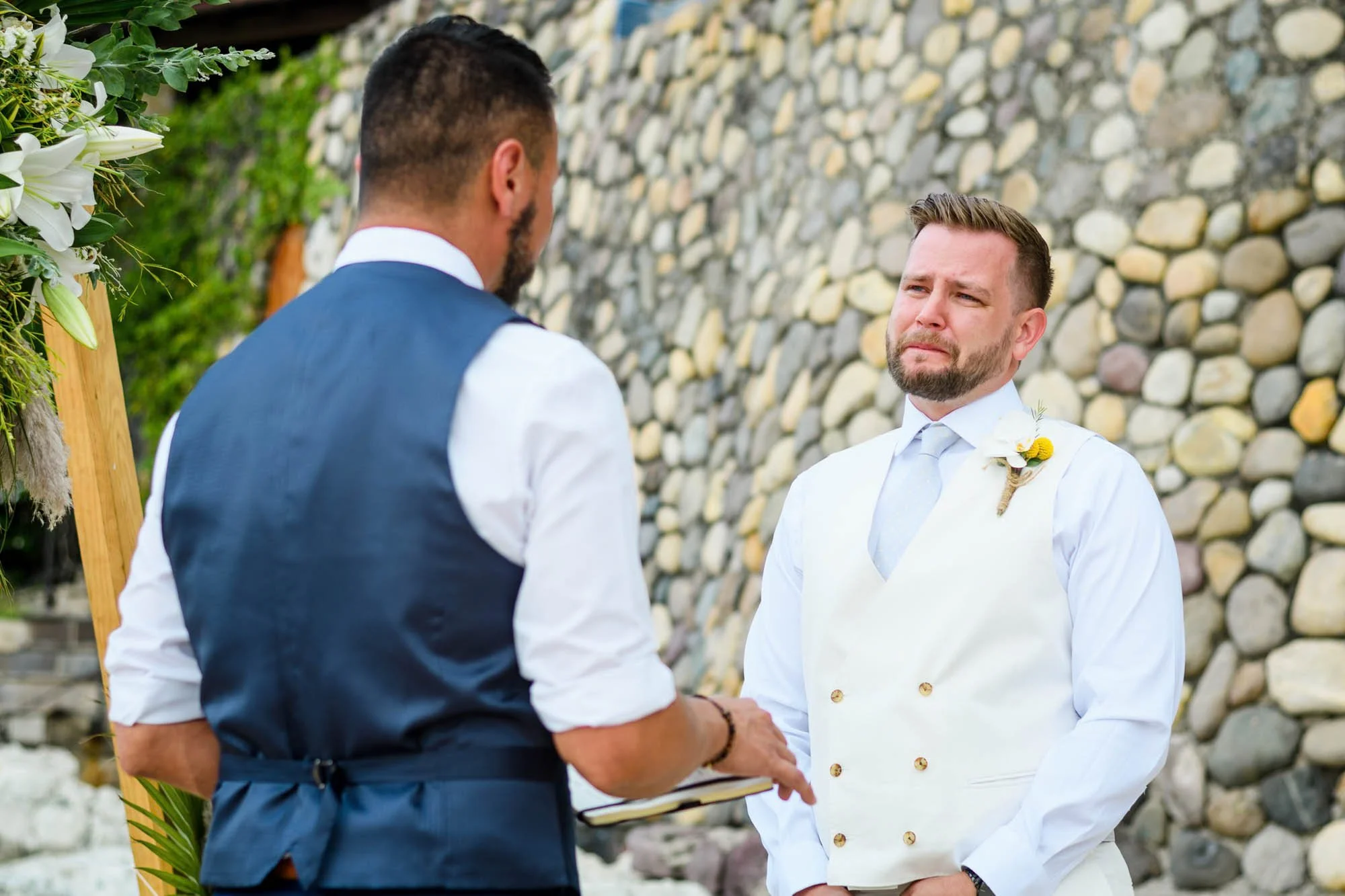 Emotional groom during their vow exchange at the Conchas Chinas beach