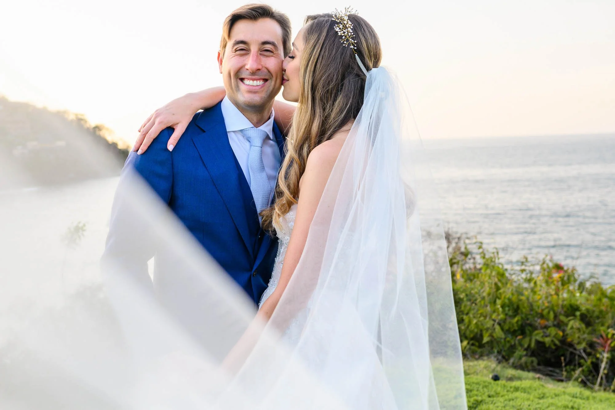 Bridal portrait during sunset with ocean in the background.