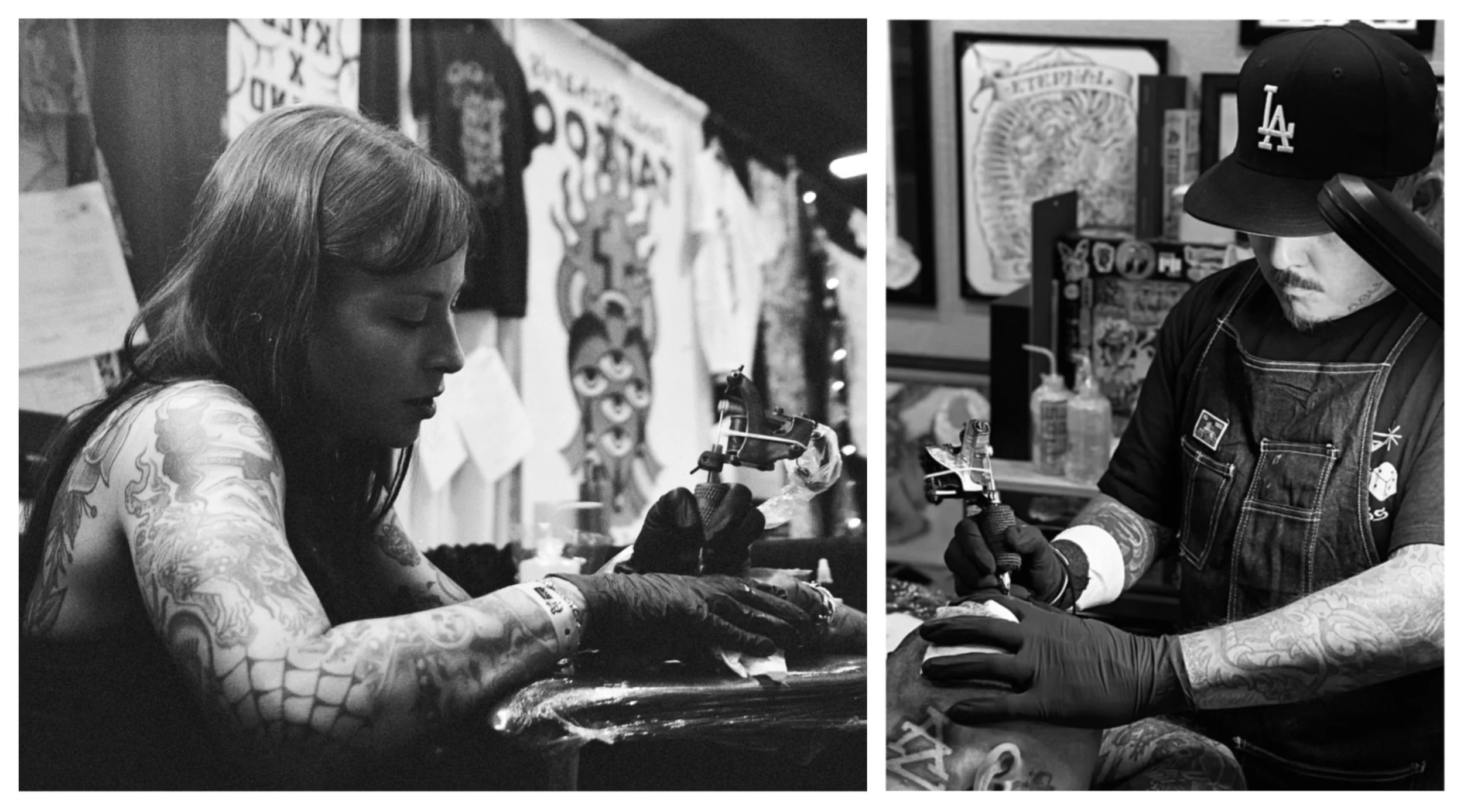 A tattoo artist and a client working together in a tattoo shop, both focused on the tattooing process. The tattoo artist is a woman with long hair and tattoos on her arms, wearing gloves, and appears to be applying a tattoo. The client, with tattoos on his arms, is wearing a Los Angeles Dodgers cap and a denim vest. The background features artwork and tattoo-related items.