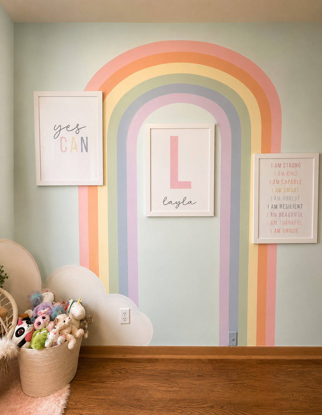 Cozy pastel nursery with rainbow mural
