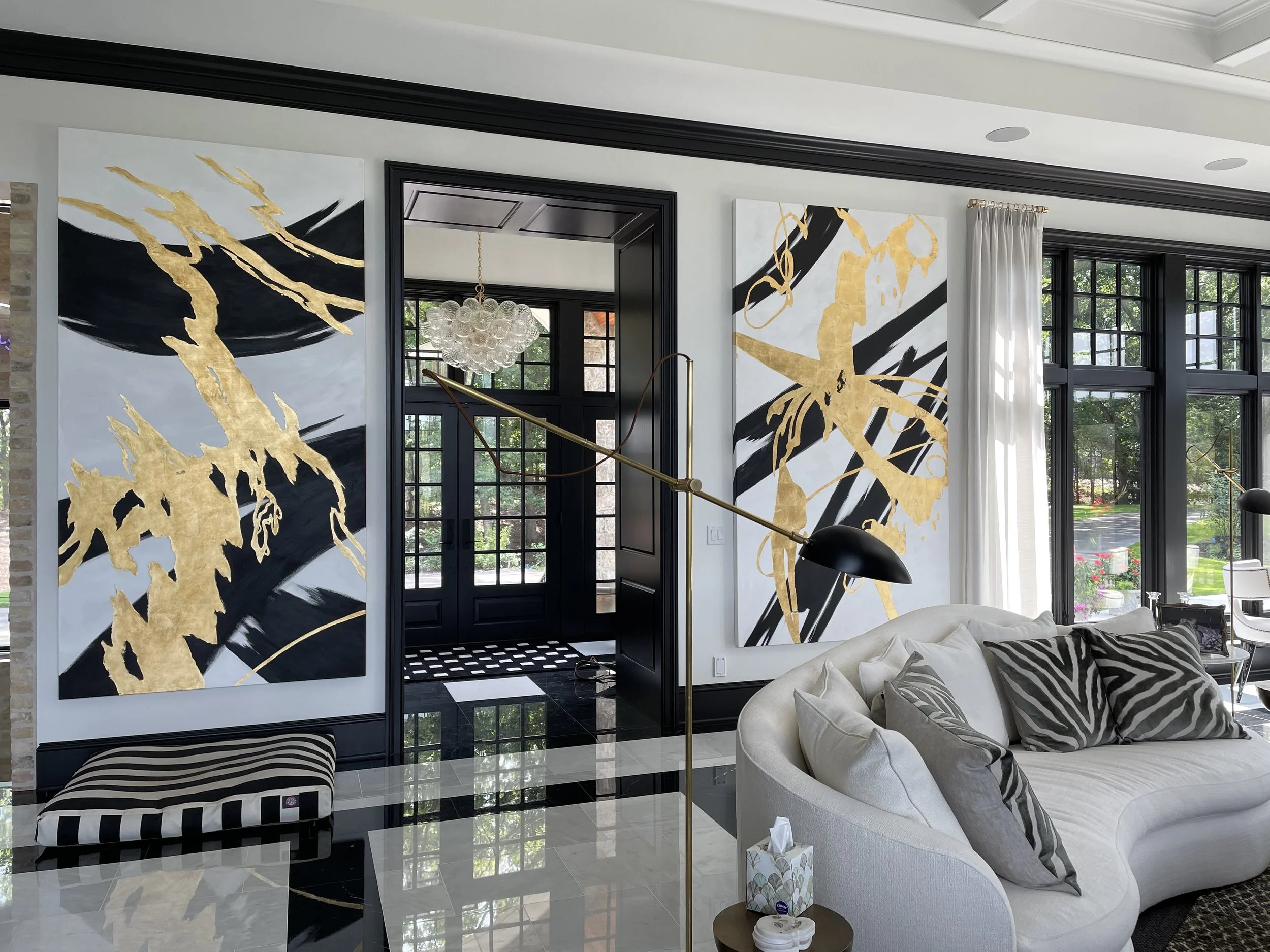 Original abstract black and gold fine art painting displayed in a modern home entryway near Milwaukee, WI