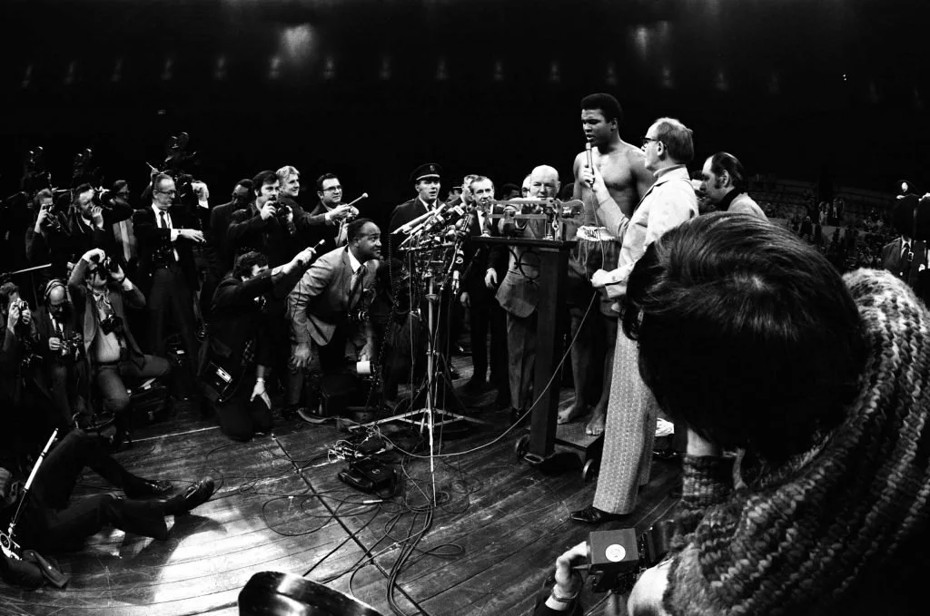 Muhammad Ali with the press during a pre-fight weigh-in at Madison Square Garden in March 1971.