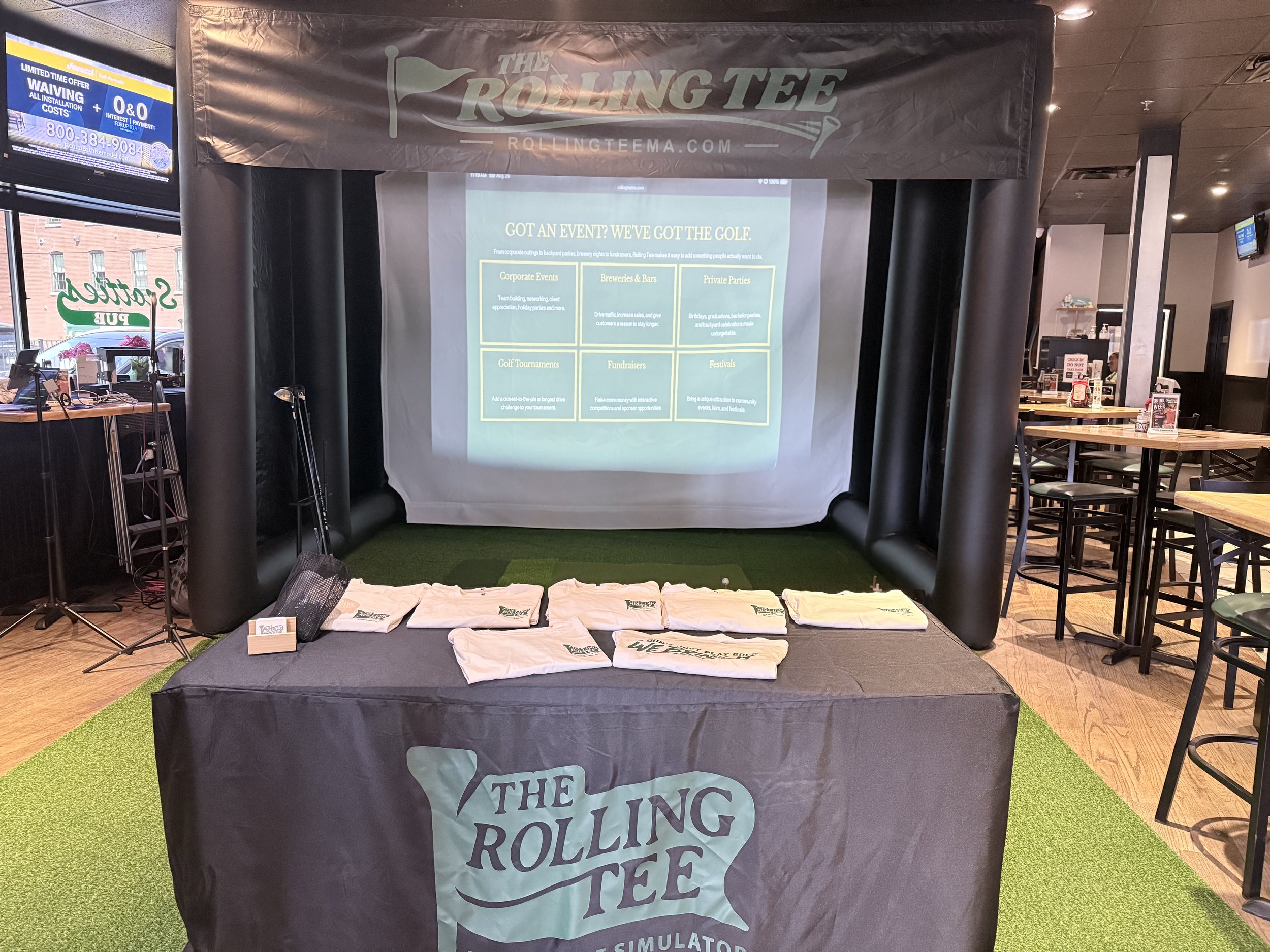 Mobile golf simulator set up for an event at Scottie’s Pub in Fall River, Massachusetts.