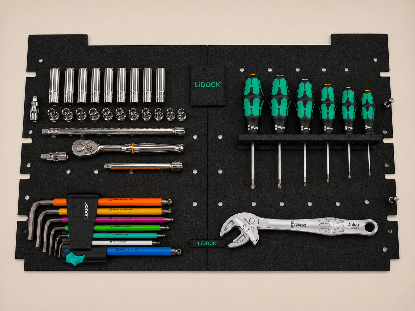 Tool organizing board with various tools including sockets, screwdrivers, wrenches, Allen wrenches, and bits.