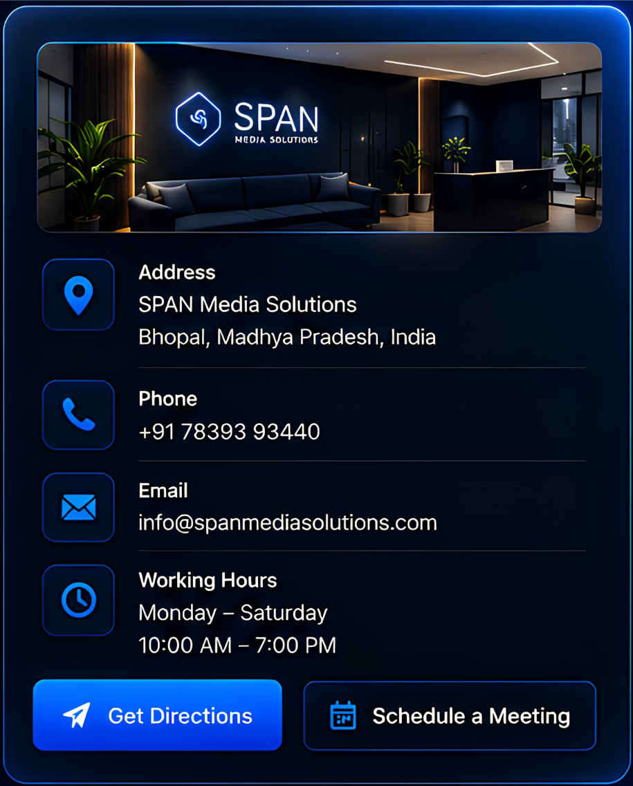 Indoor office reception area at SPAN Media Solutions with a modern dark-themed design, a neon sign, sofa, plants, and contact information including address, phone, email, and working hours.
