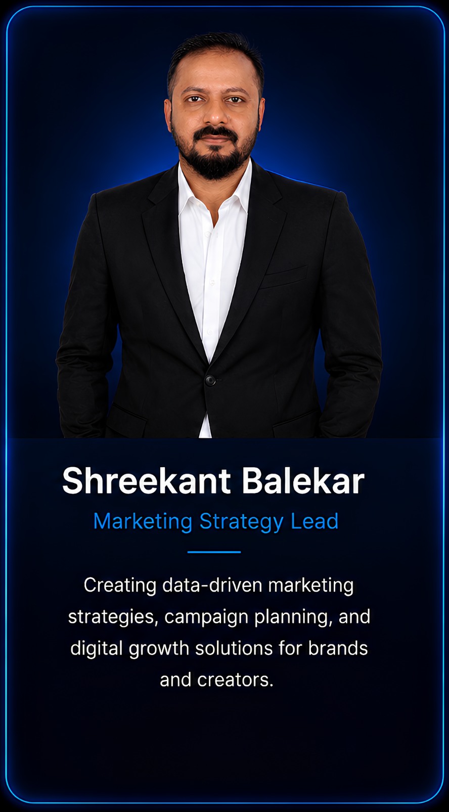 Professional portrait of Shreekant Balekar, a man with a beard and mustache, dressed in a black blazer and white shirt, against a dark blue background with a neon border, with his name and job title on a digital card overlay