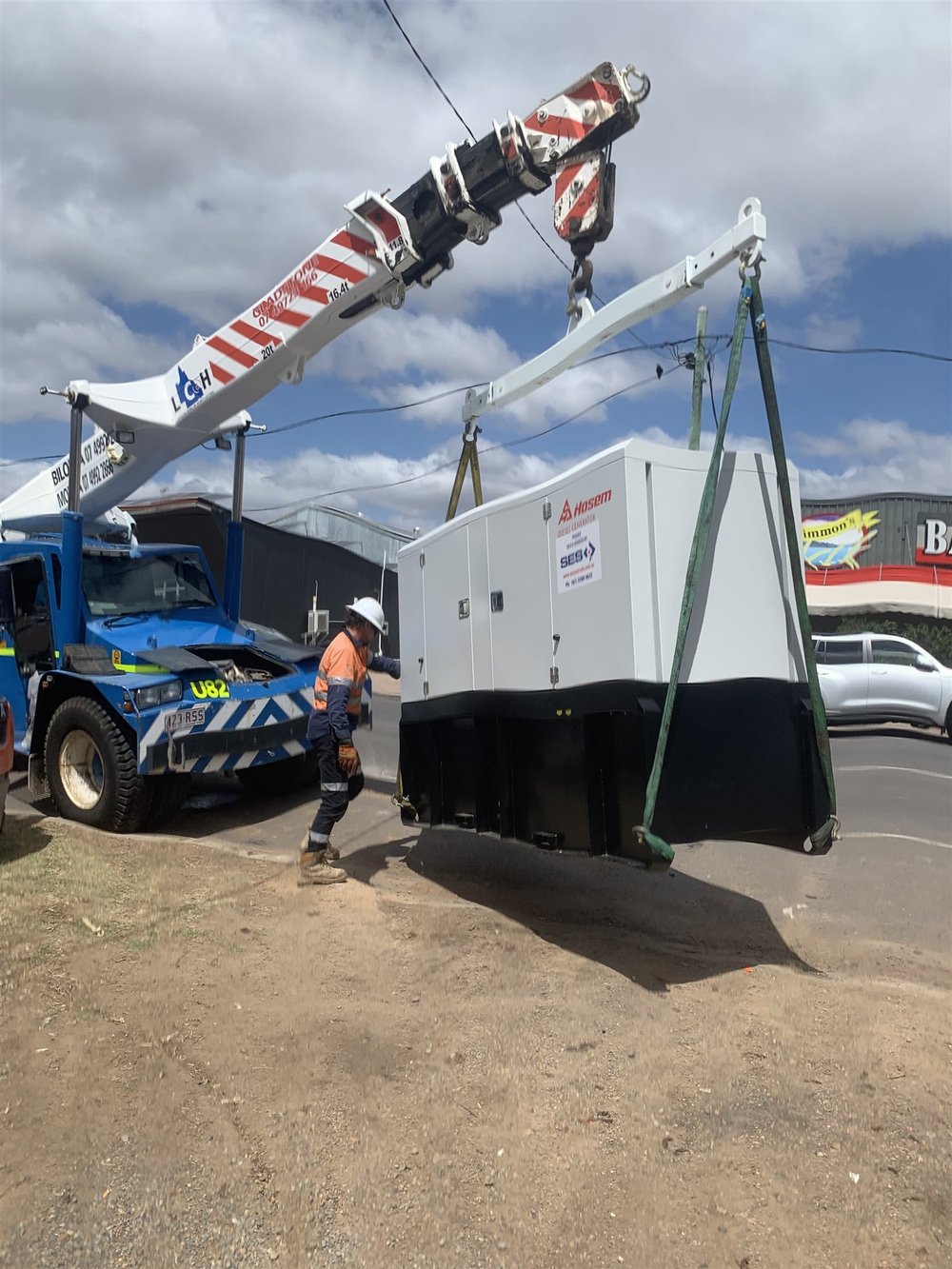 Generator lifted into place by crane