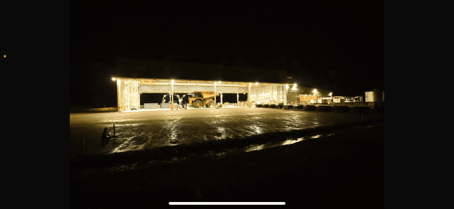 Mine site workshop lit up at night after an electrical install