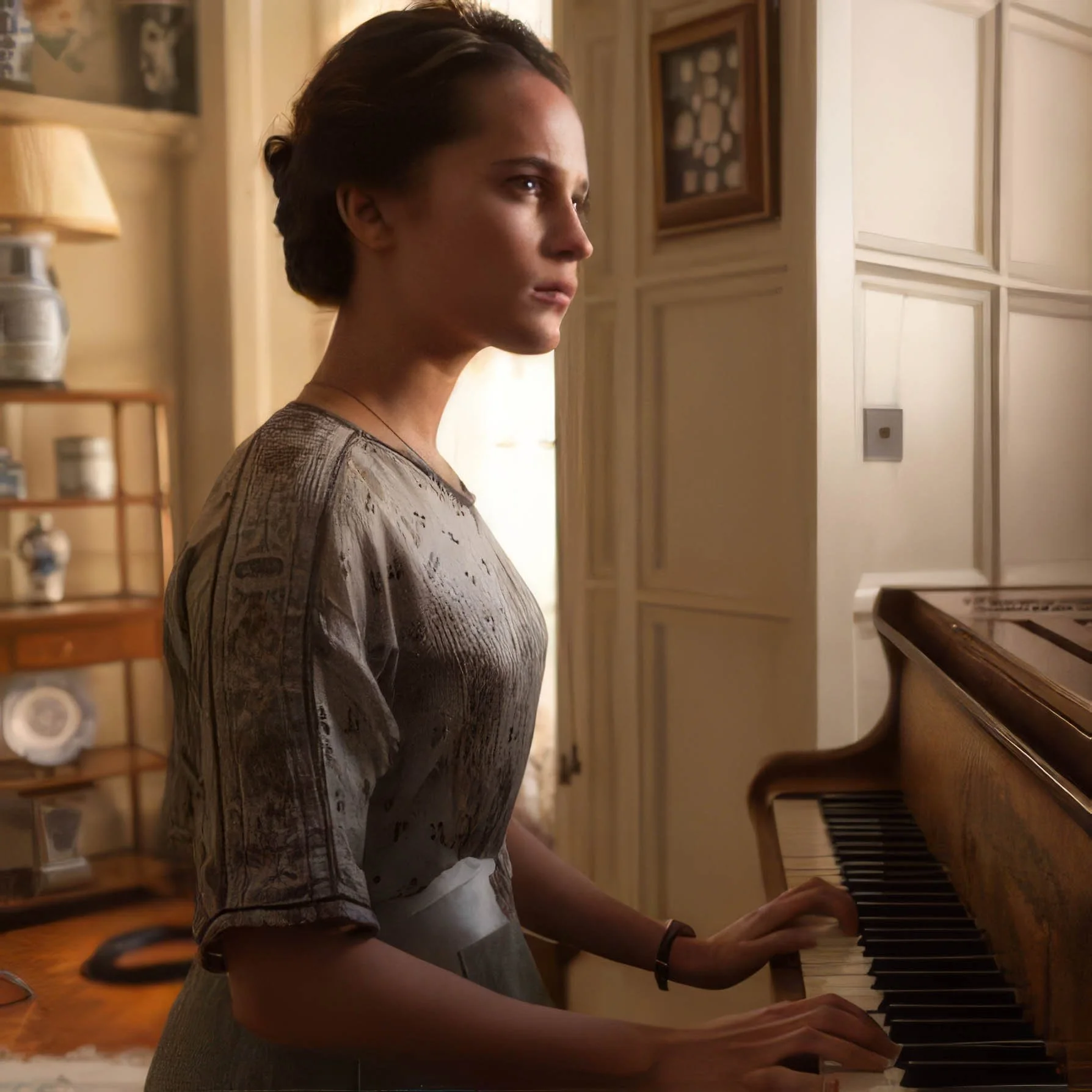 A young woman with short brown hair is playing an upright piano in a warmly lit room. She is wearing a gray patterned dress and a wristwatch, with a focused expression on her face as she plays the piano.