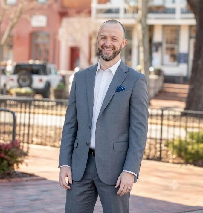 Tim Gibson, a Dahlonega and North Georgia real estate agent, smiling outdoors.