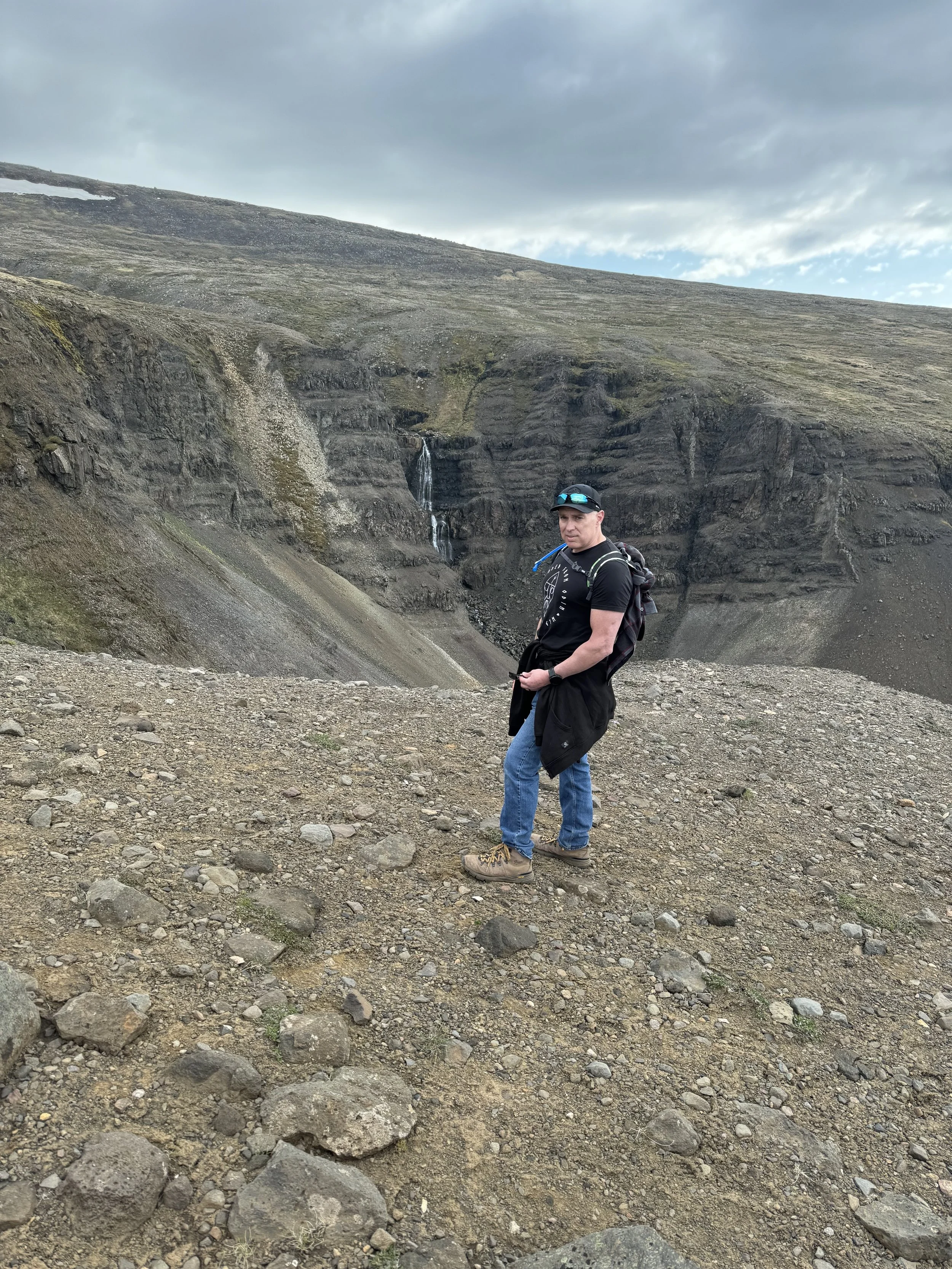Hiking the mountains and waterfall near Husafell, Iceland. Living Tactically and Loving Adventurously together.