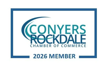 Conyers-Rockdale Chamber of Commerce 2026 member logo with blue text and border.